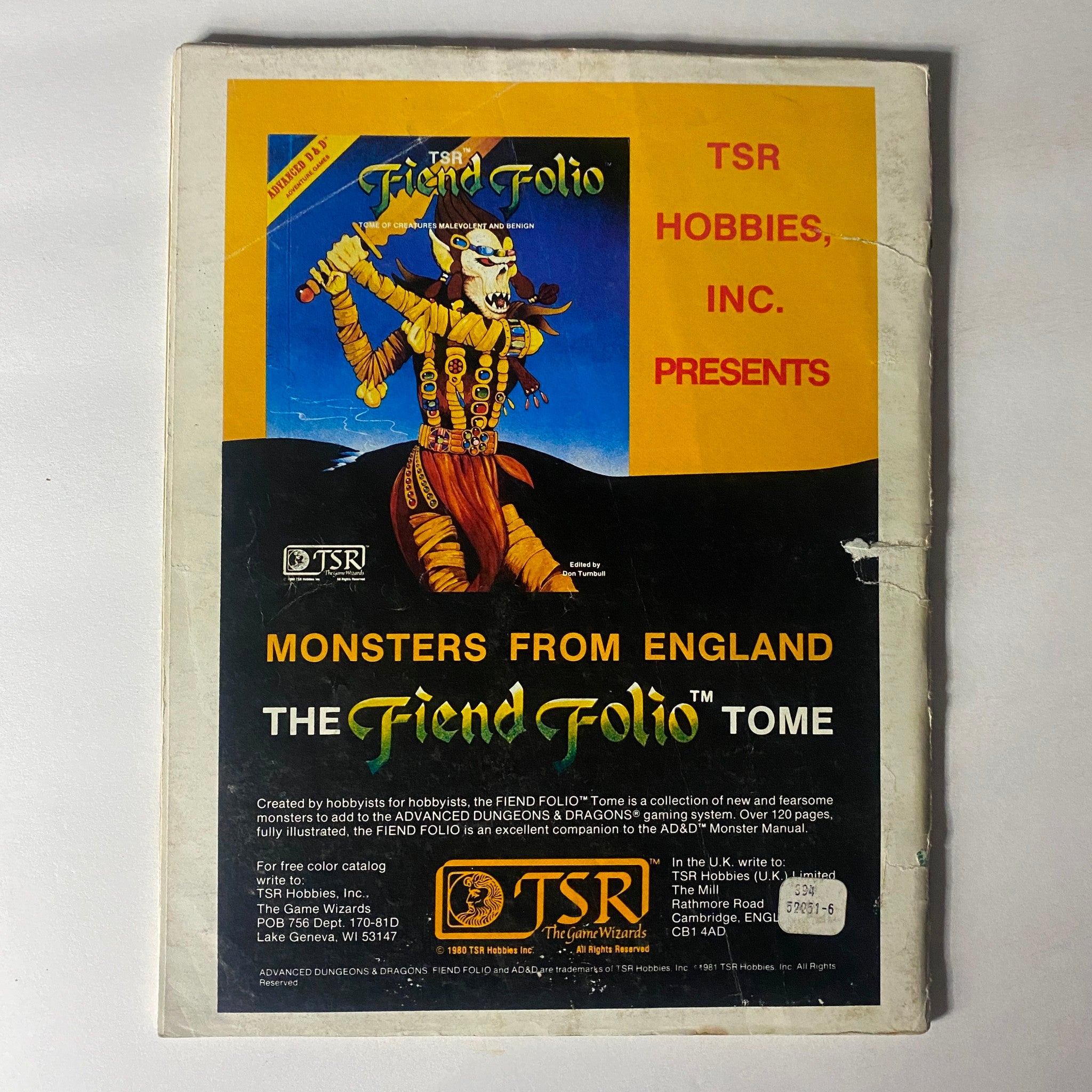 Back cover of VTG Dragon Magazine December 1981 #56 displaying promotional artwork for TSR's 'Fiend Folio', featuring a character illustration and details about the publication.