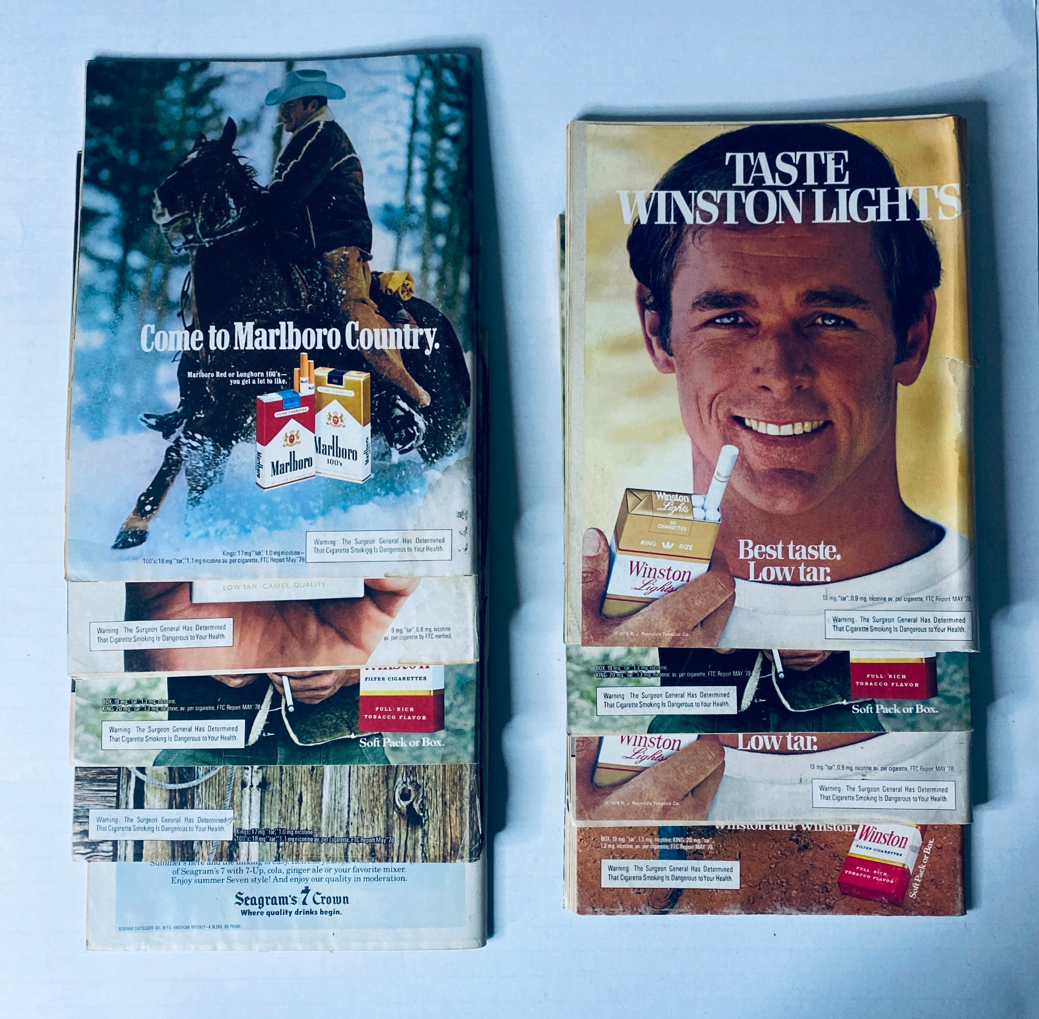 Advertisements from vintage magazines, featuring Marlboro and Winston Light cigarettes, displaying nostalgic marketing from the 1970s.