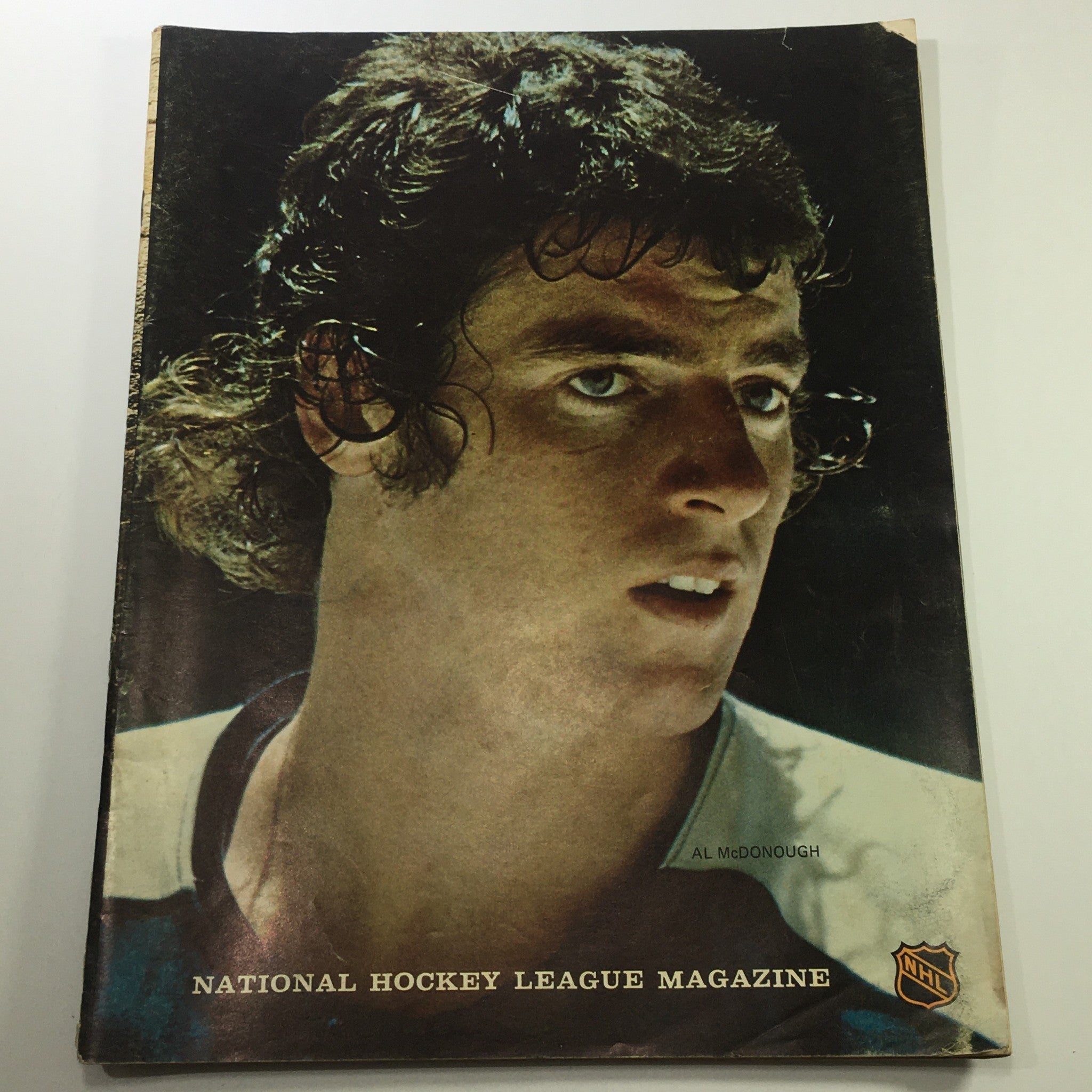 Cover of VTG NHL Philadelphia Flyers Magazine dated January 25, 1973 featuring striking artwork by Al McDonough, showcasing a vintage hockey theme.