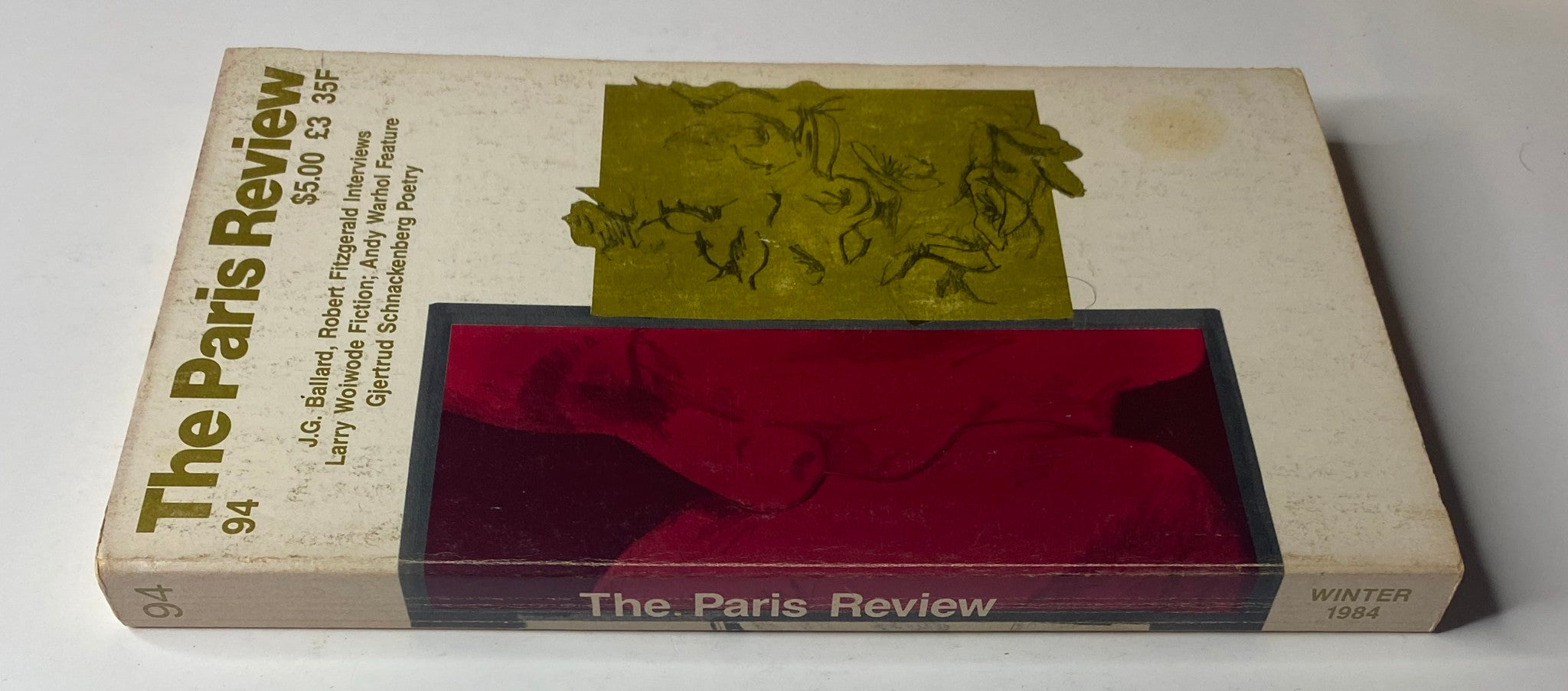 Side view of The Paris Review Magazine Winter 1984, No. 94, displaying the title and themes including J. G. Ballard, Robert Fitzgerald, and Andy Warhol.