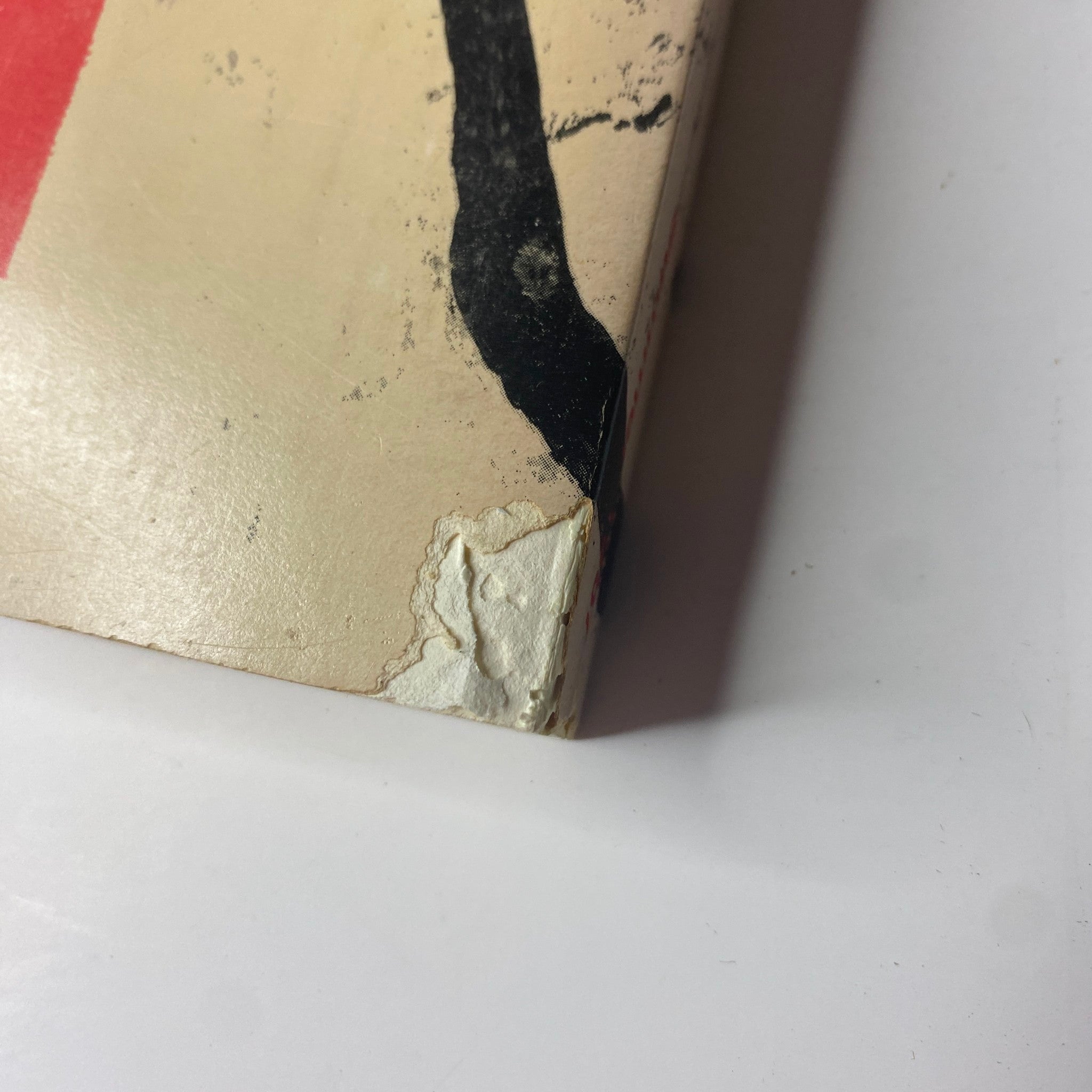 Close-up of the corner damage on the cover of The Paris Review Magazine Summer 1987 No. 103, illustrating the wear and natural aging of vintage publications.