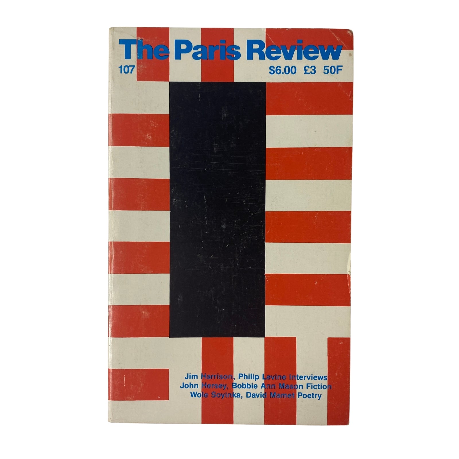 Cover of The Paris Review Magazine Summer 1988 No. 107 featuring a distinctive striped design in red, black, and white, highlighting contributions from Jim Harrison, Philip Levine, and Wole Soyinka.