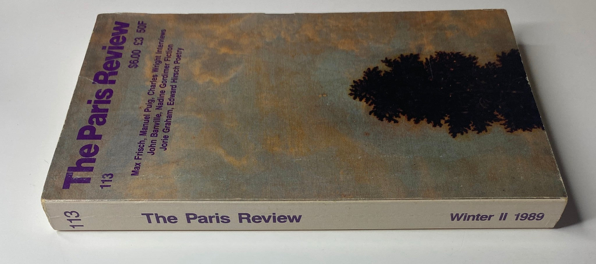 Side view of The Paris Review Magazine Winter II 1989 No. 113, highlighting its title and issue number along with additional details about the featured authors.