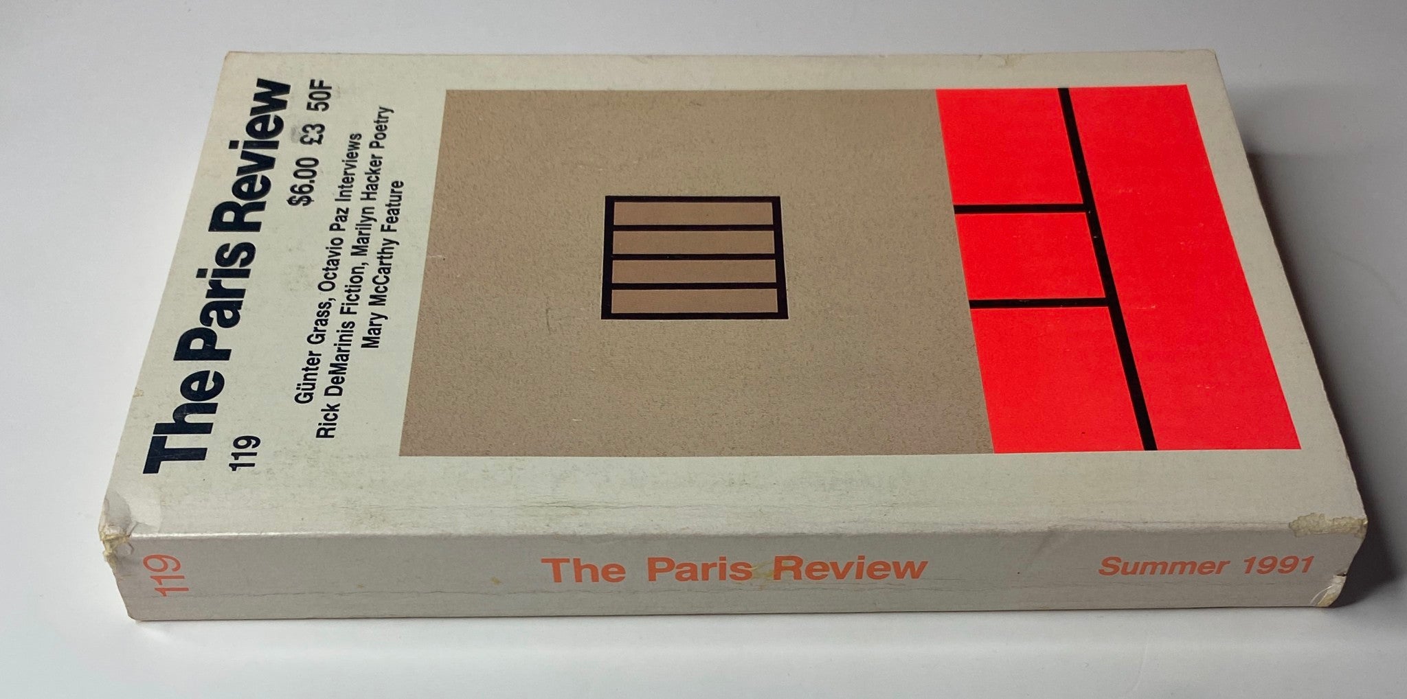 Spine view of The Paris Review Magazine Summer 1991 No. 119 showcasing the title and publication details, including featured authors and interviews within the issue.