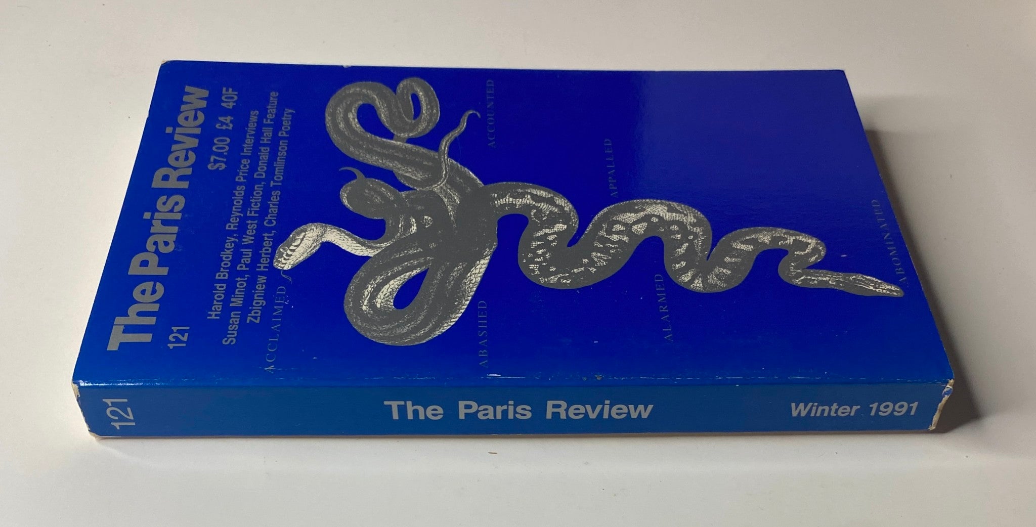 Spine view of The Paris Review Magazine Winter 1991 No. 121 showcasing its blue cover design and title.