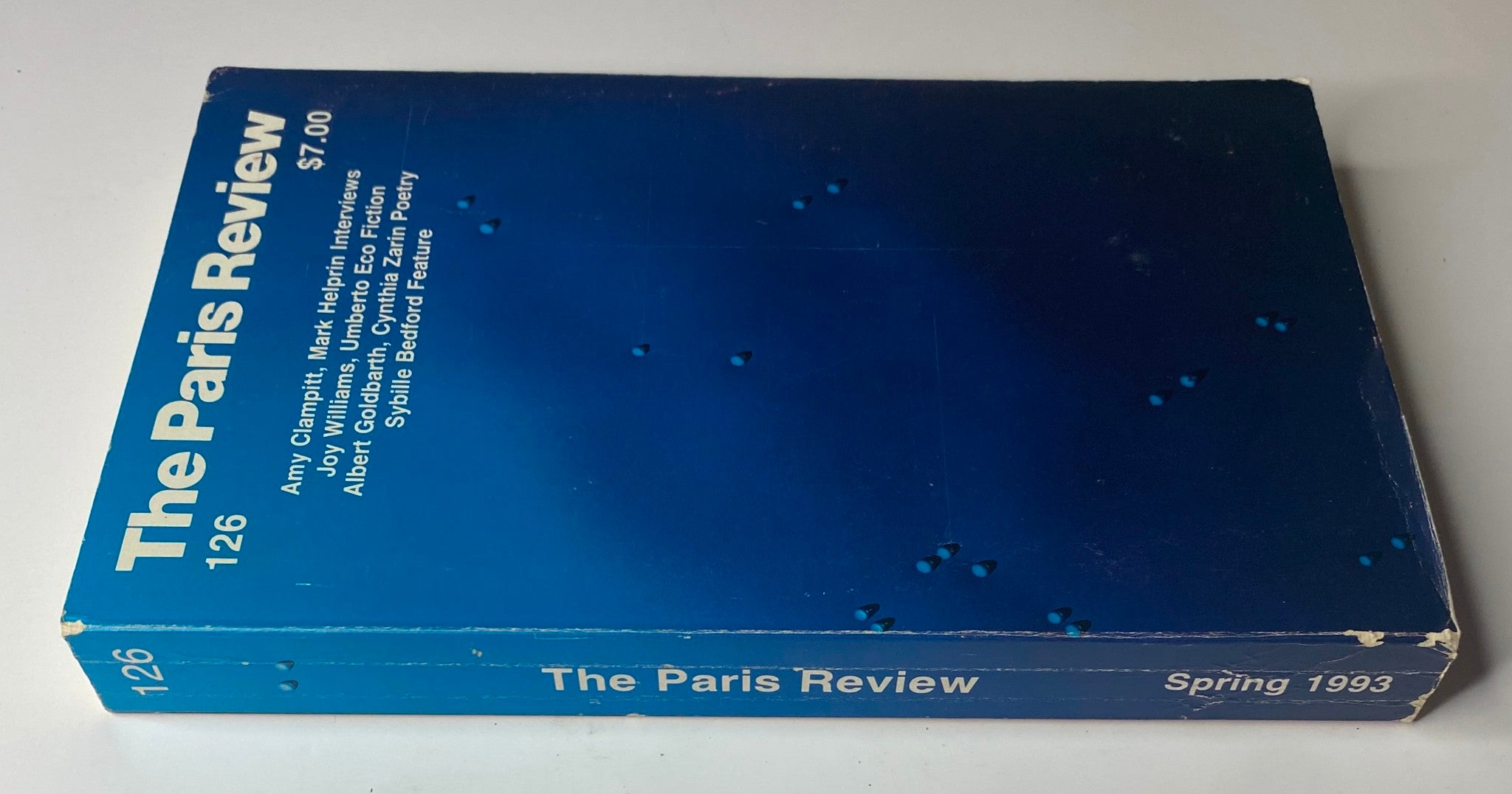 Spine view of The Paris Review Magazine Spring 1993 No. 126 showing its title and contributors including Joy Williams and Umberto Eco.