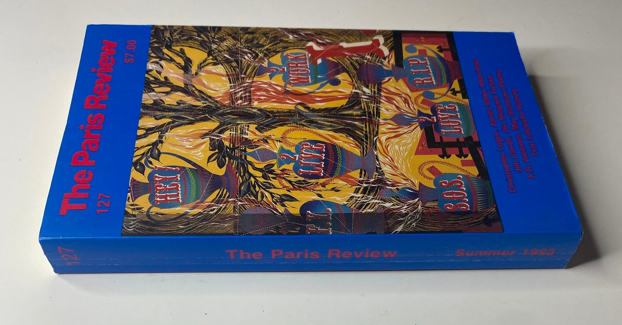 The side view of The Paris Review Magazine Summer 1993 No. 127, showcasing the striking cover design and title.