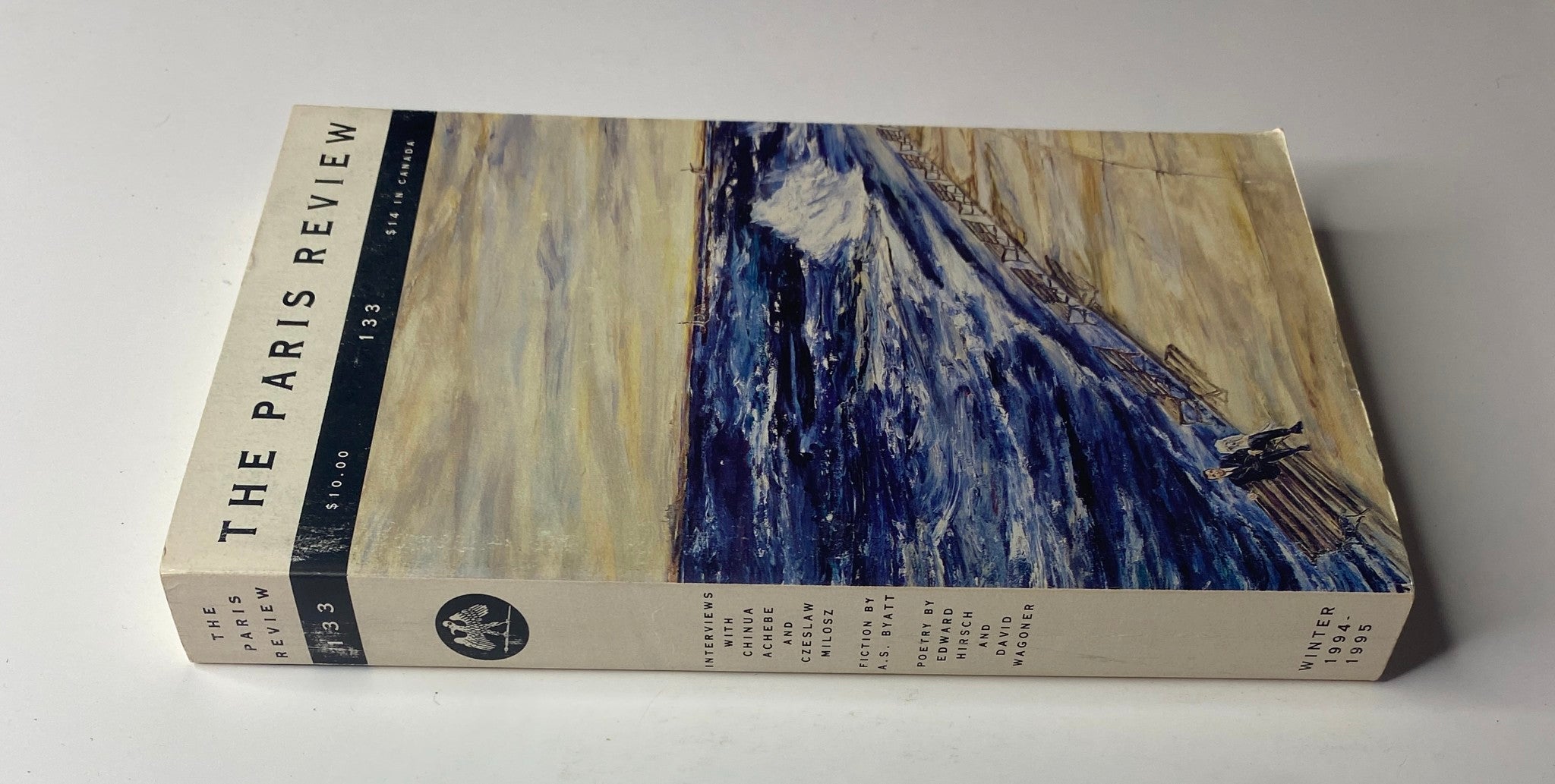 Side view of The Paris Review Magazine Winter 1994-1995 No. 133 showcasing its title and issue number, featuring a scenic artwork.