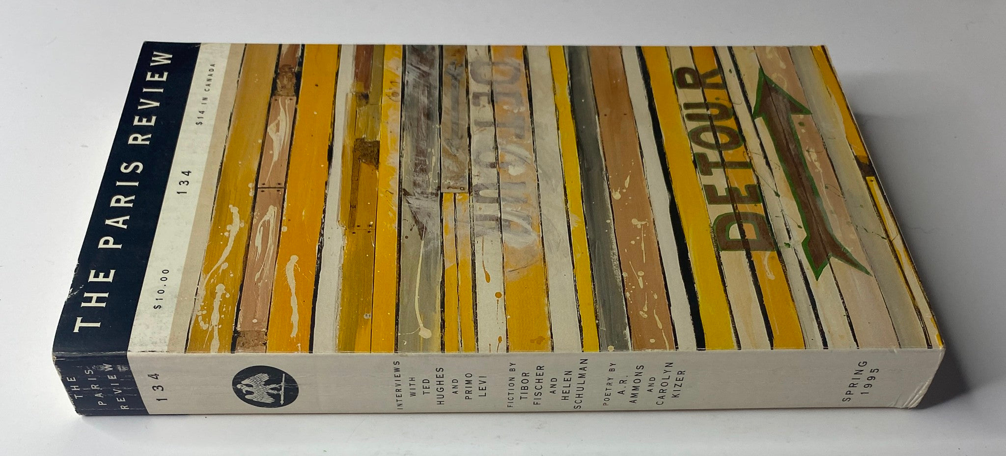 Side view of The Paris Review Magazine Spring 1995 No. 134 showing the spine and cover with a striped pattern and the title.