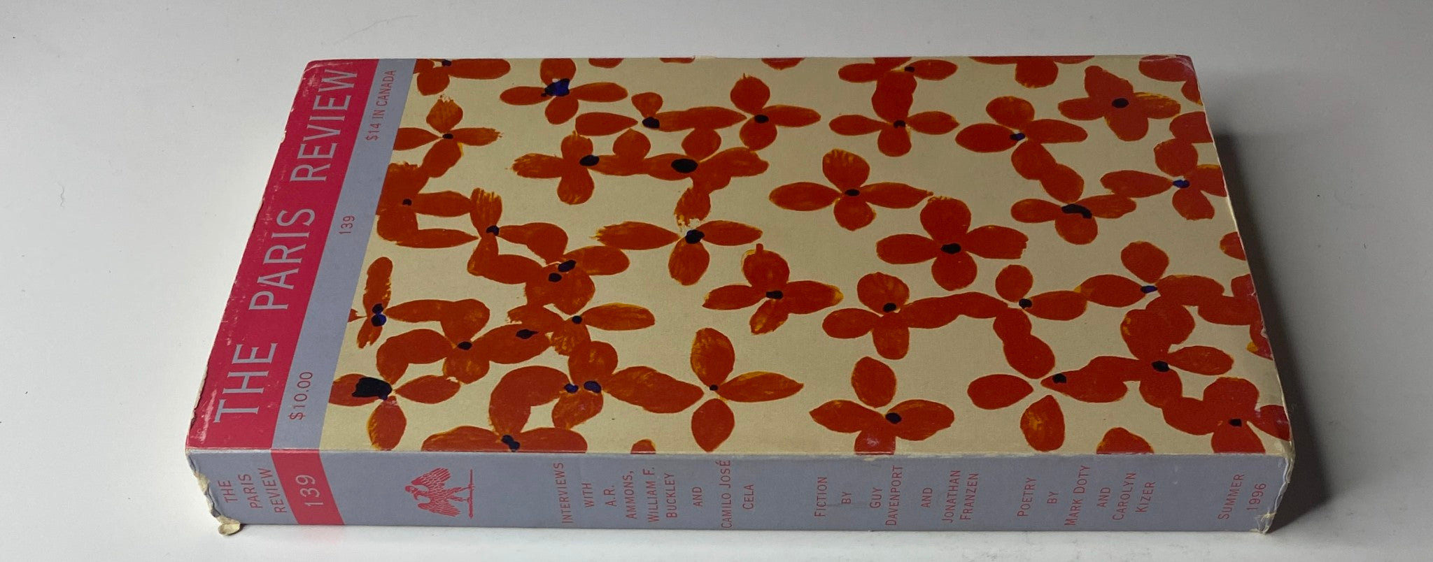 Side view of The Paris Review Magazine Summer 1996 No. 139 John Hopkins, highlighting its distinctive cover art.