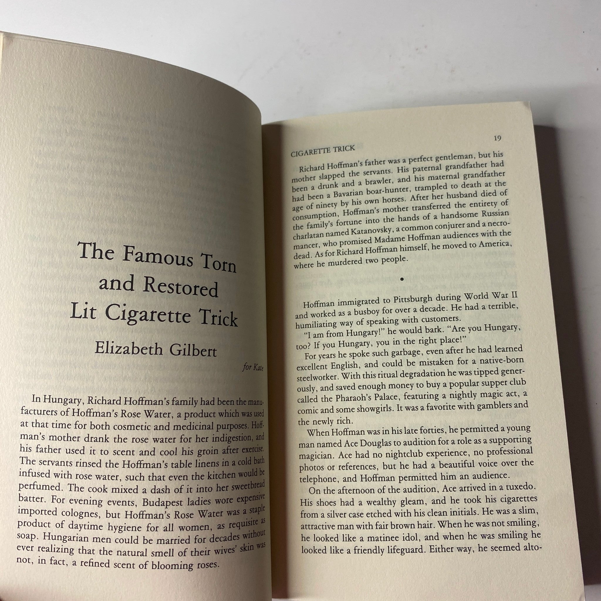 Page showcasing the story 'The Famous Torn and Restored Lit Cigarette Trick' by Elizabeth Gilbert in The Paris Review Magazine Winter 1996 No. 141.