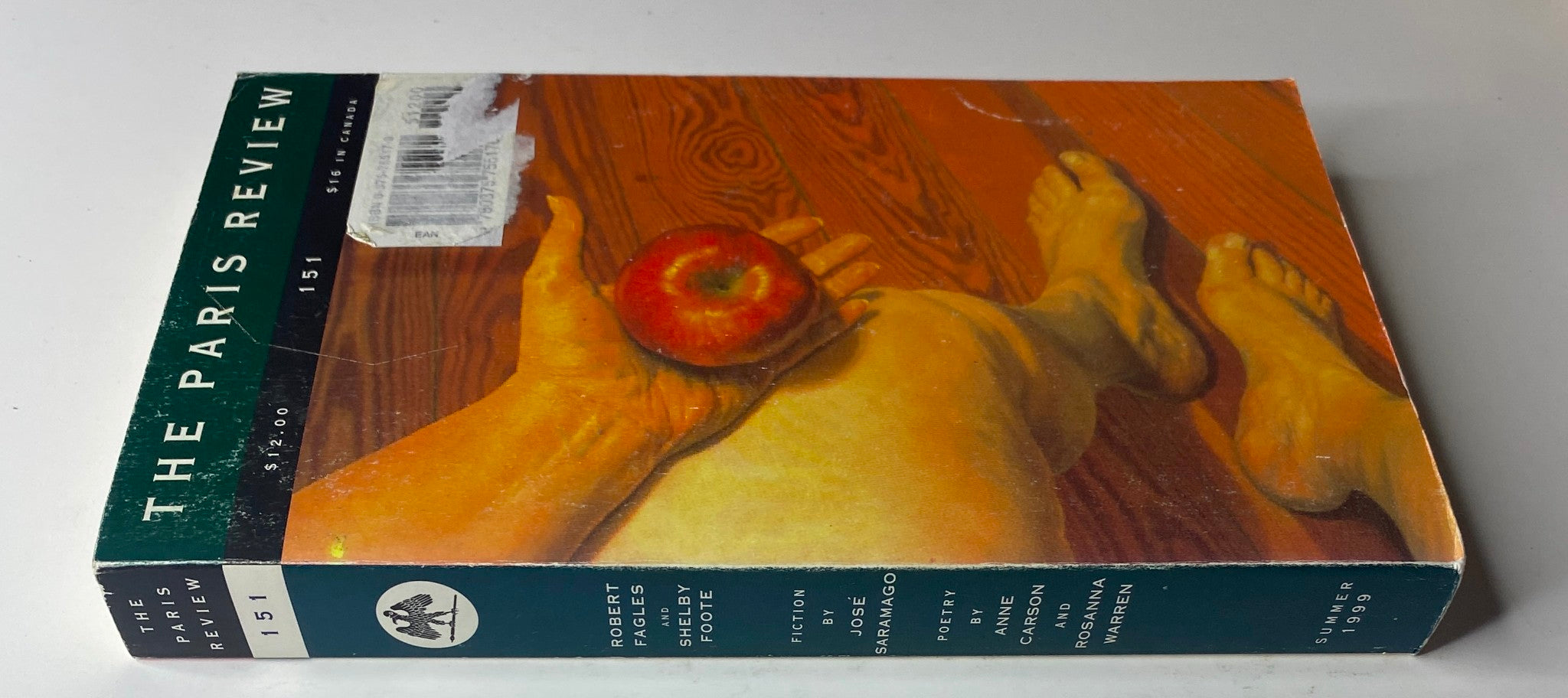 Side view of The Paris Review Magazine Summer 1999 No. 151 showcasing the title and a colorful cover design with an apple.
