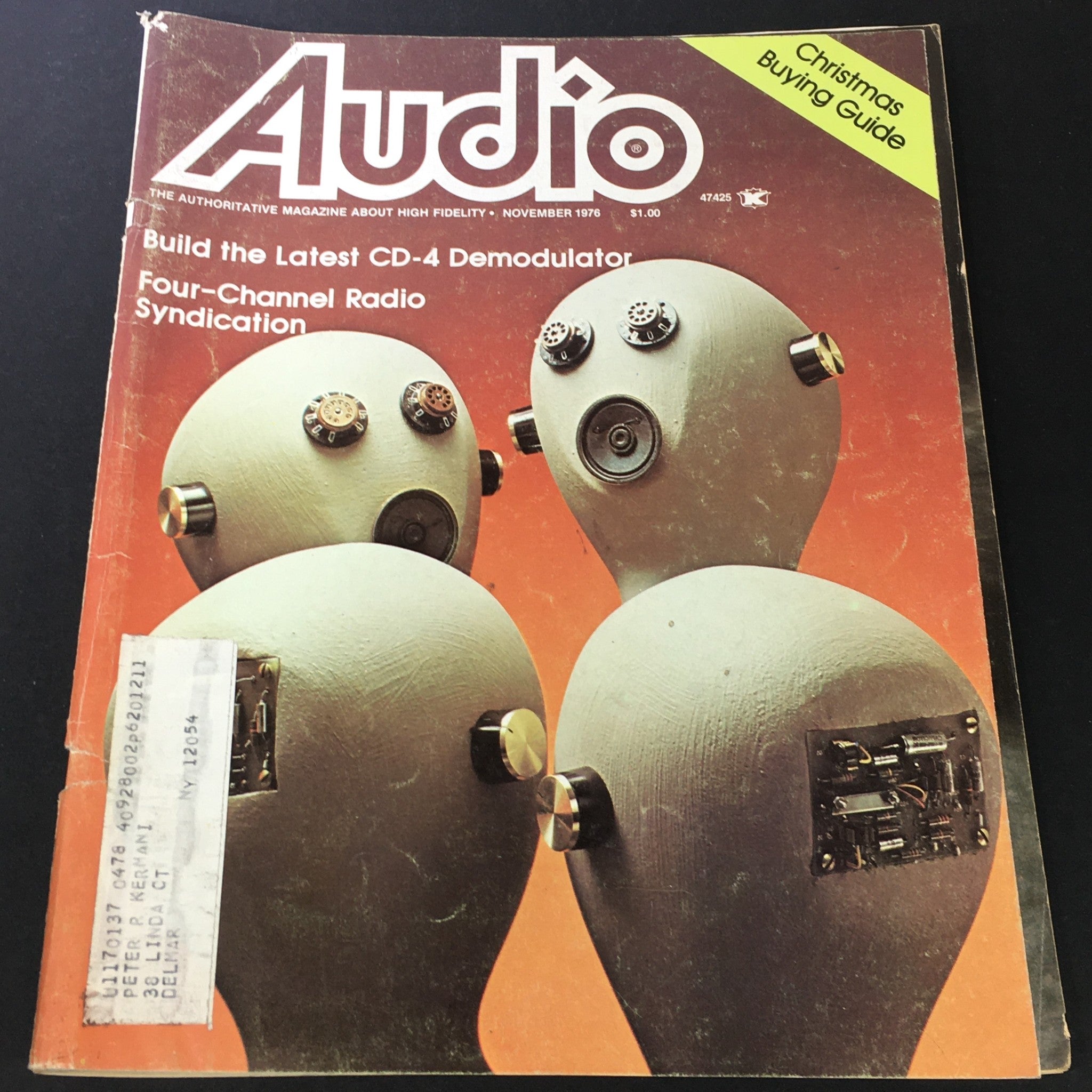 Cover of VTG Audio Music Magazine from November 1976 featuring Four-Radio Channel Radio Syndication and a unique artistic design with quirky character-like figures.