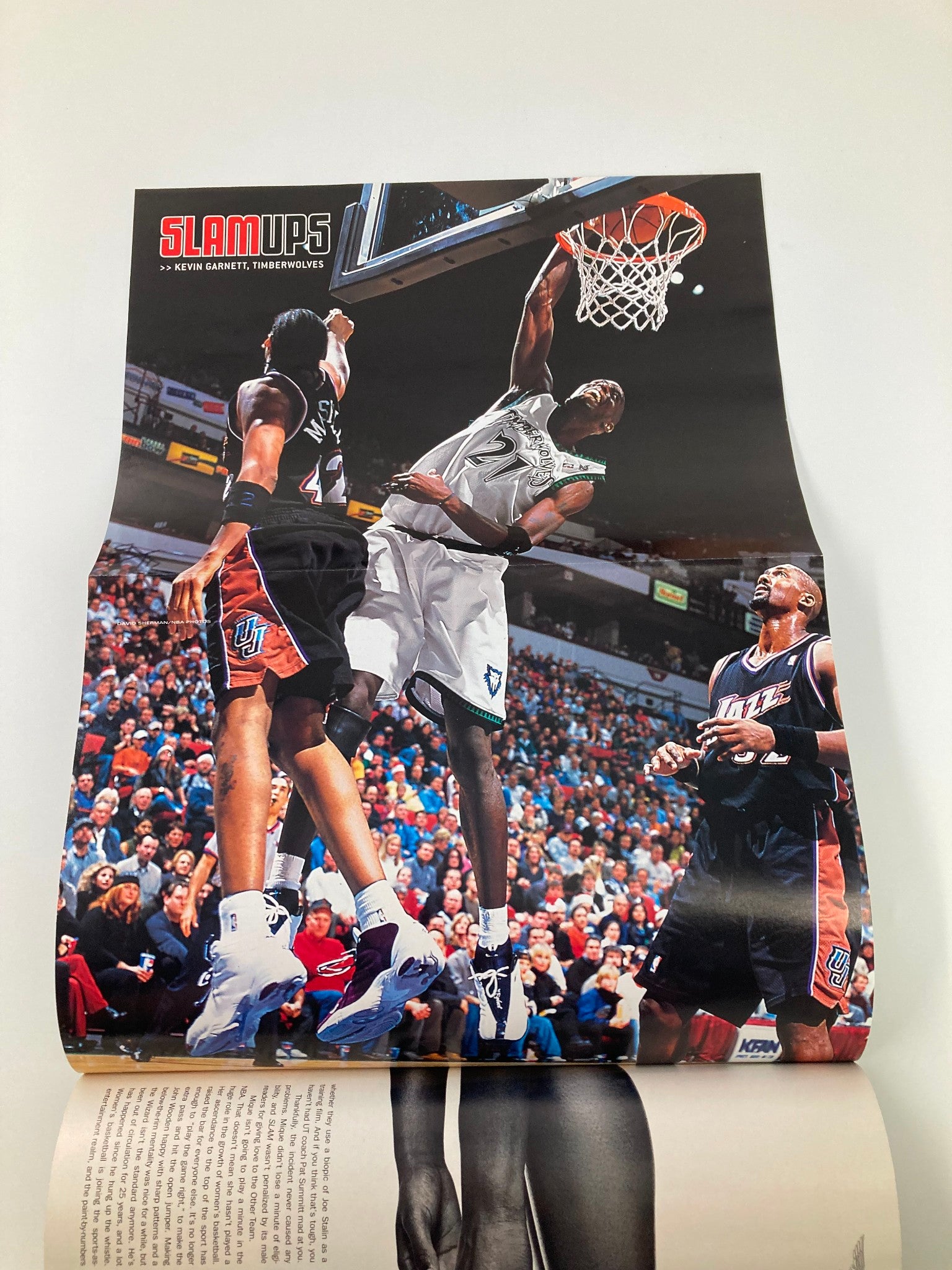 Slam Magazine April 2001 #50 includes a poster of Kevin Garnett dunking during a game, showcasing the excitement of live basketball action.