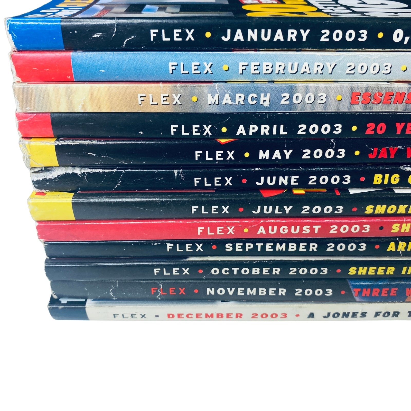 Lot of 12 Flex Magazine 2003 Full Year January to December - Spine view of all issues from January to December 2003, highlighting the month and year on each edition.
