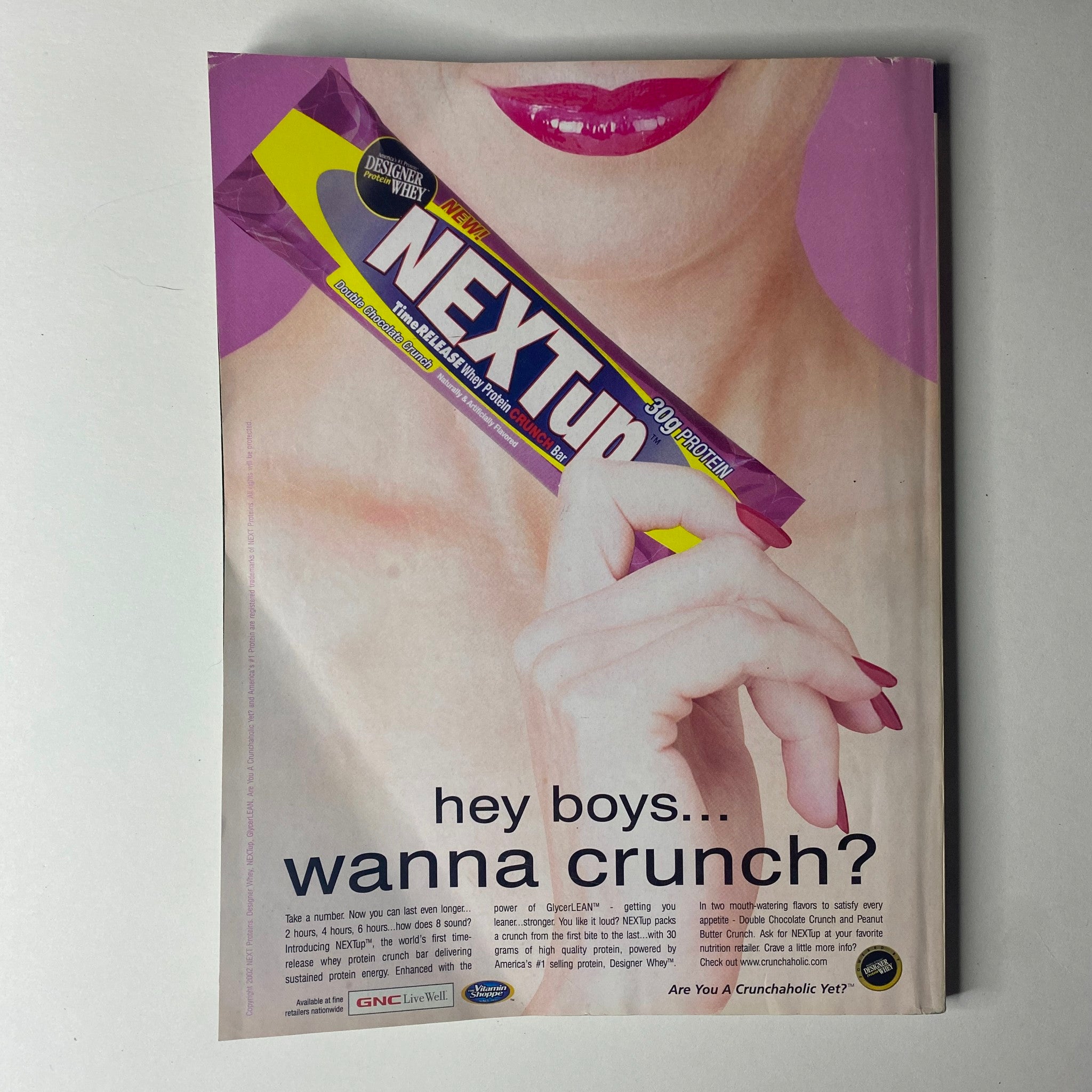 Advertisement from Flex Magazine December 2002 for Next Up protein bar, appealing to fitness enthusiasts with a catchy tagline.