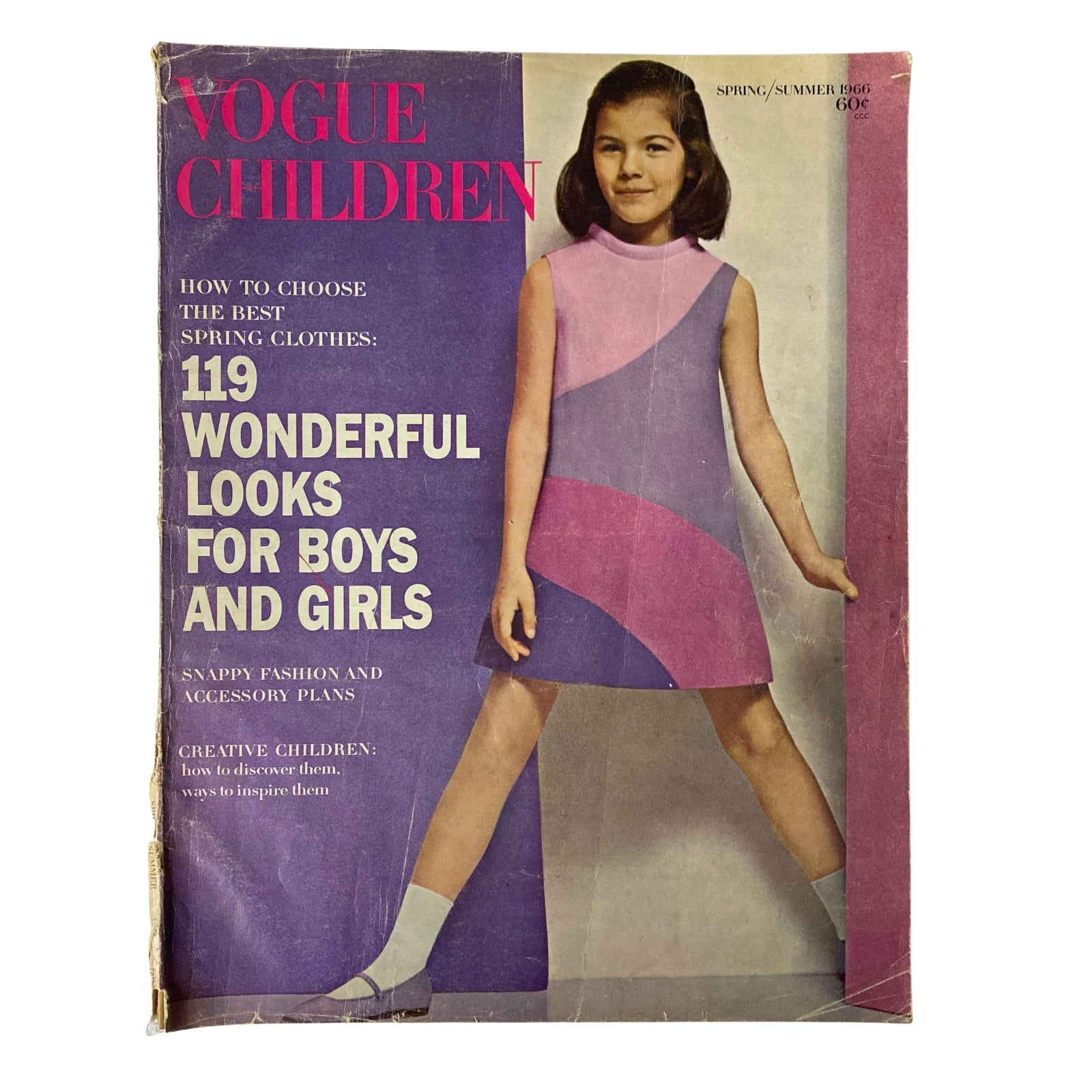Cover of the 1966 Vogue Children Spring and Summer Catalog featuring a young girl in a stylish dress with a colorful design, highlighting children's fashion.