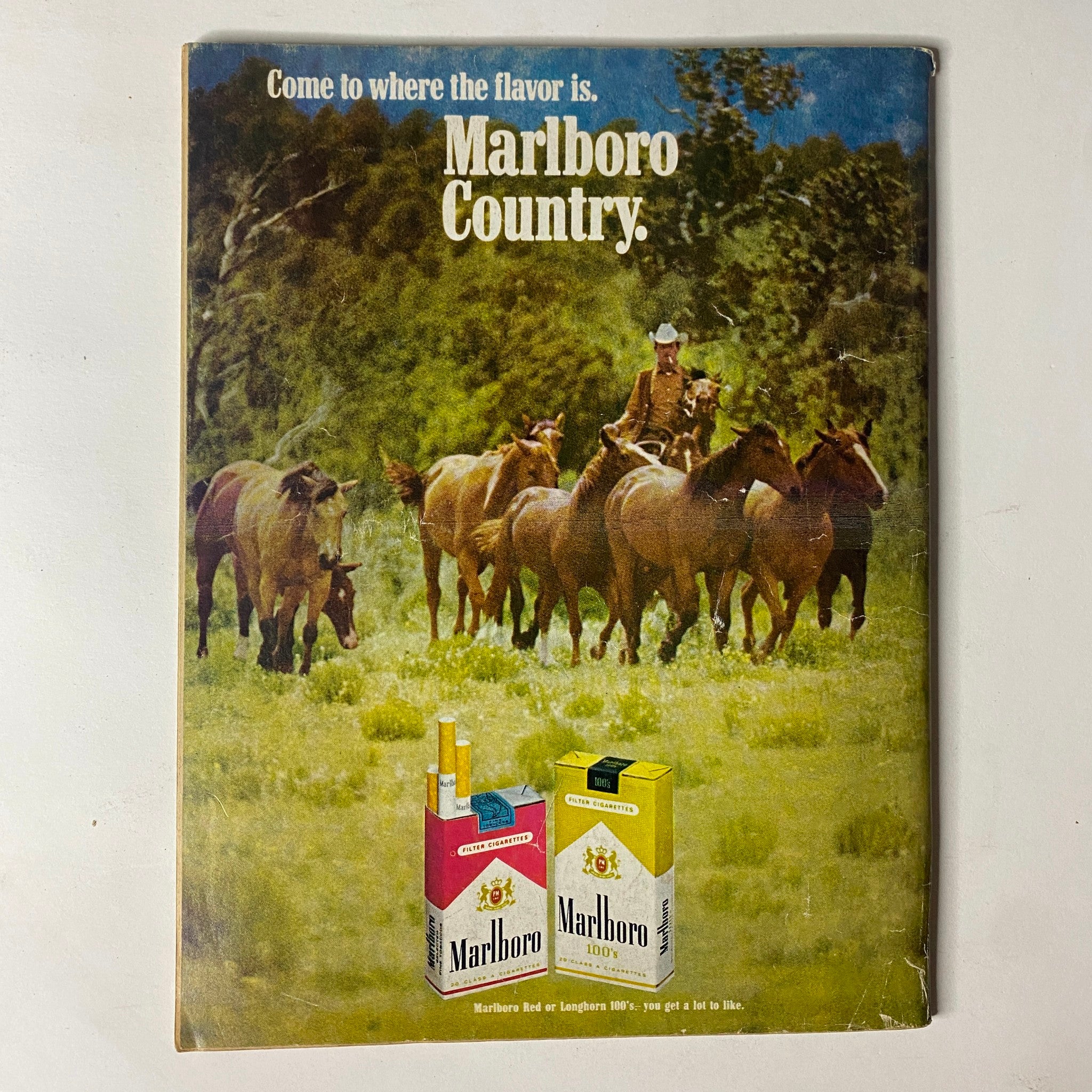 Back cover of Car Craft Magazine February 1970 Vol 18 No. 2 featuring a Marlboro advertisement with a cowboy and horses in a rural setting.