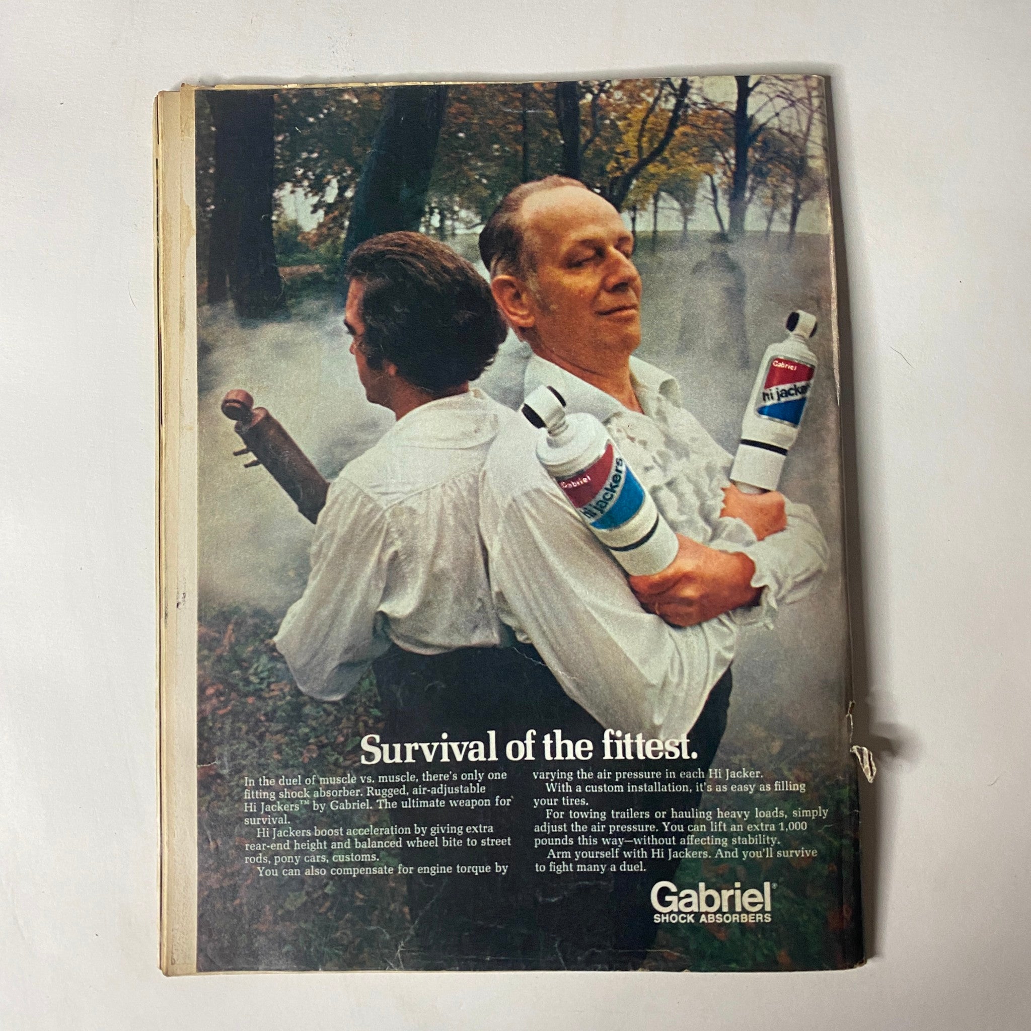 Back cover of Car Craft Magazine July 1972 featuring an advertisement for Gabriel Stock Absorbers with the slogan 'Survival of the fittest'. Highlights the emphasis on competitive performance in automotive culture.