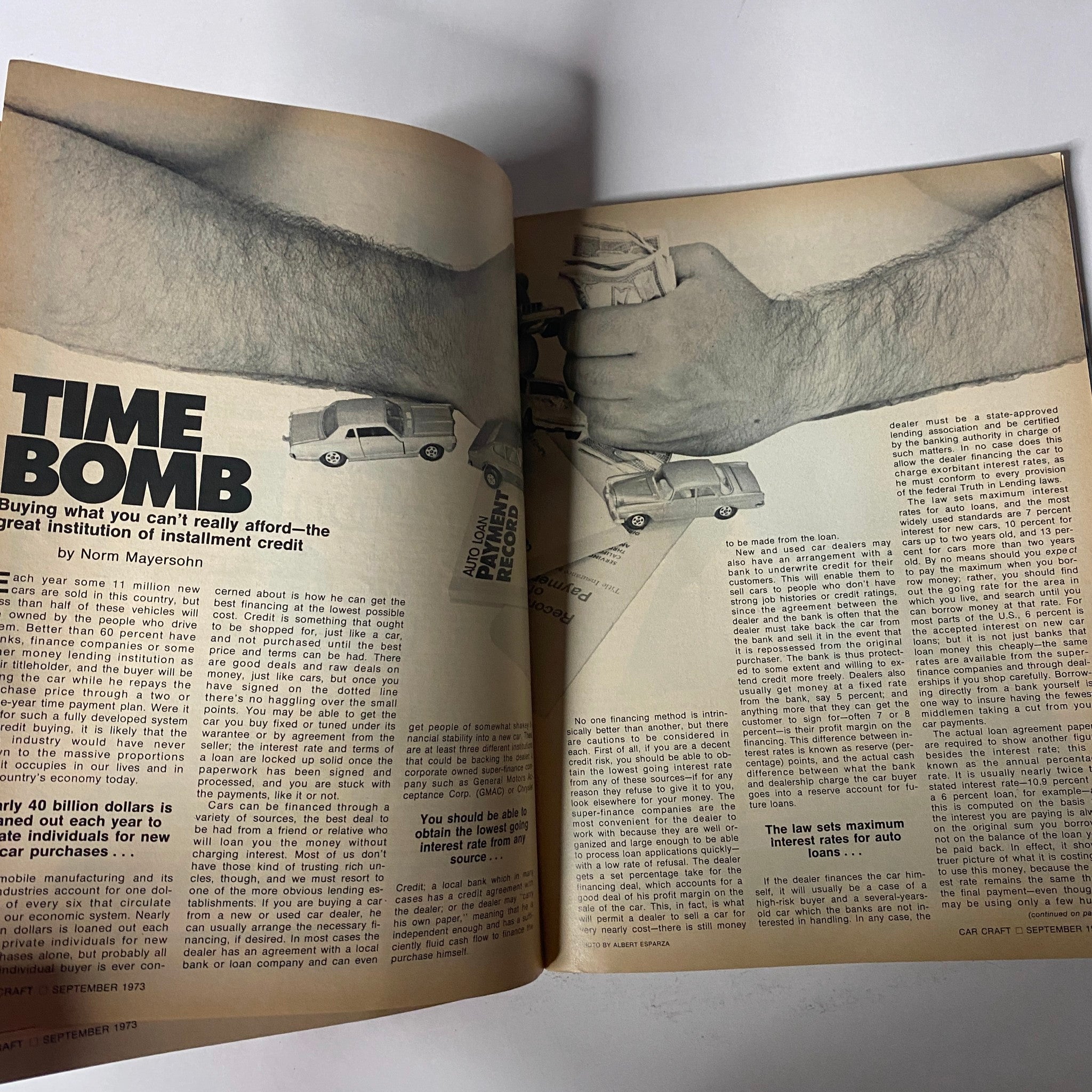 Article spread titled 'Time Bomb' from Car Craft Magazine September 1973 discussing the implications of installment credit and financing for car purchases.