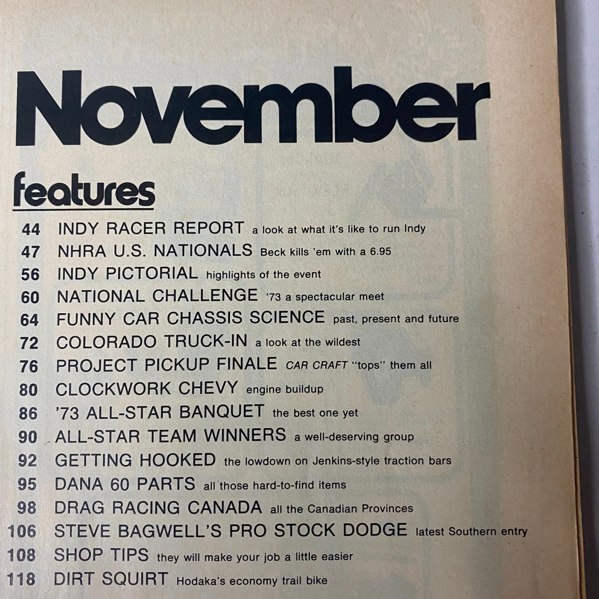Contents page of Car Craft Magazine November 1973, listing features such as Indy Racer Report and other automotive topics.
