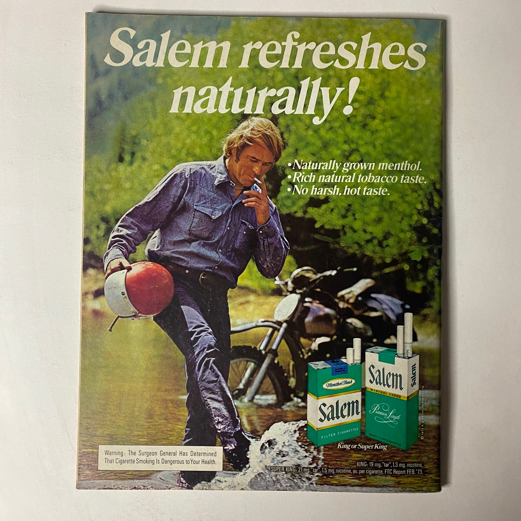 Advertisment page in Car Craft Magazine November 1973 for Salem cigarettes, featuring a man walking with a motorcycle, highlighting smoking product placement.