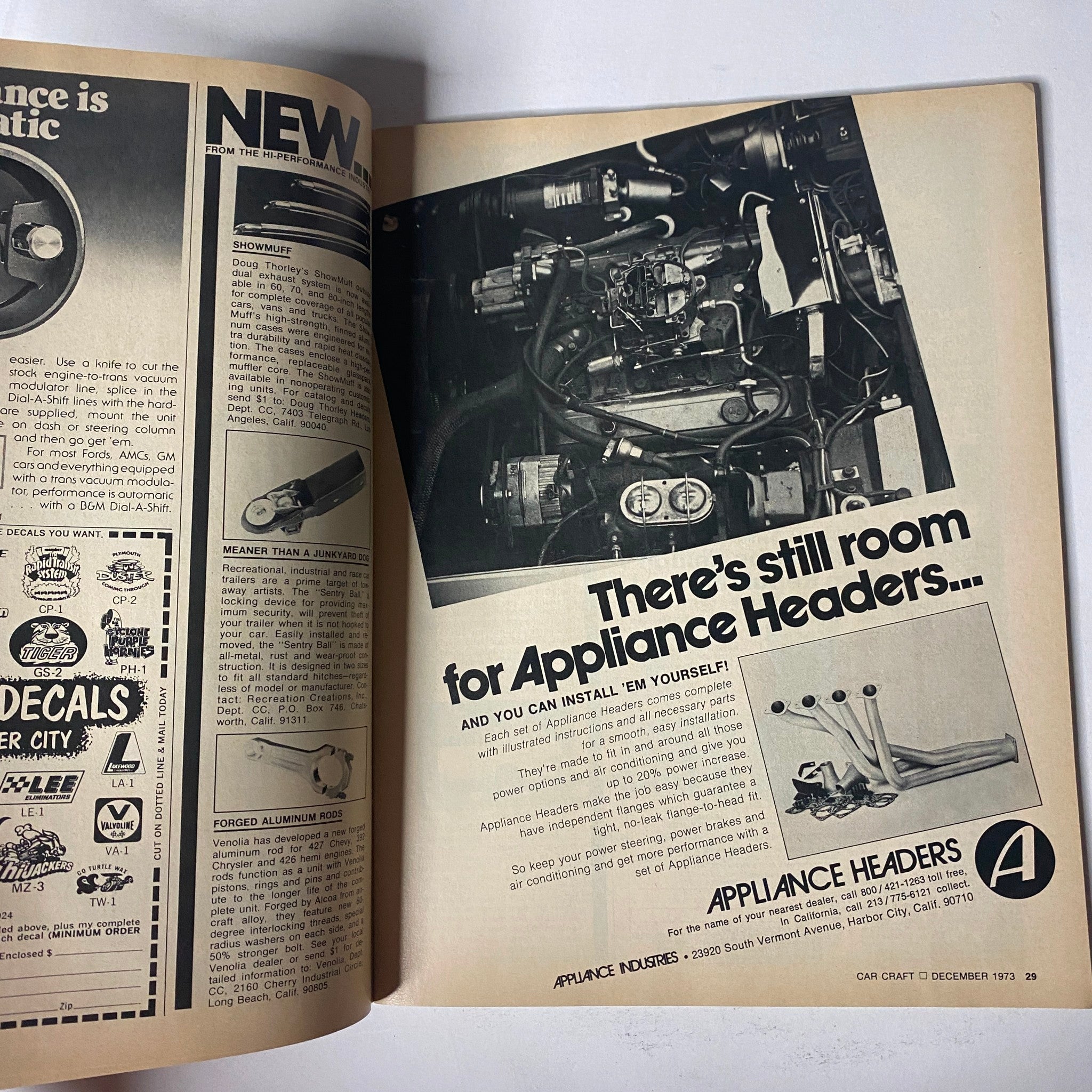 Advertisement page from Car Craft Magazine December 1973 showcasing appliance headers, aimed at car enthusiasts with a detailed graphic of engine components.