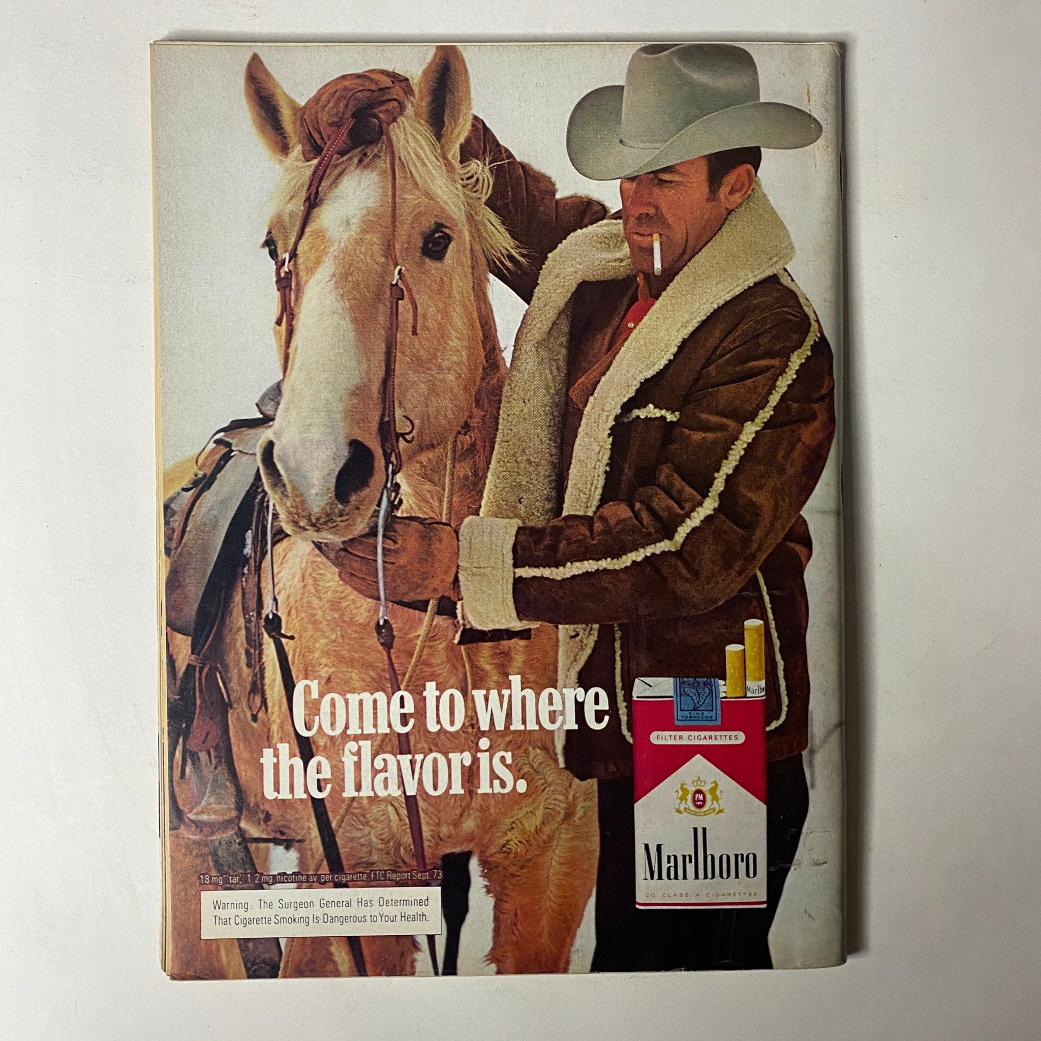 Cover of Car Craft Magazine February 1974 Vol 22 No. 2 featuring a drag racing update, showing a vintage advertisement with a cowboy and a Marlboro cigarette pack.
