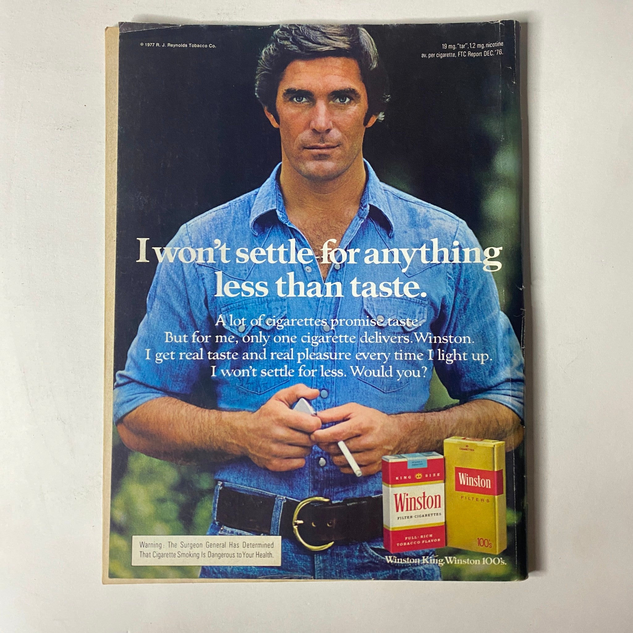 Back cover of Car Craft Magazine November 1977 featuring an advertisement for Winston cigarettes with a man holding a pack.