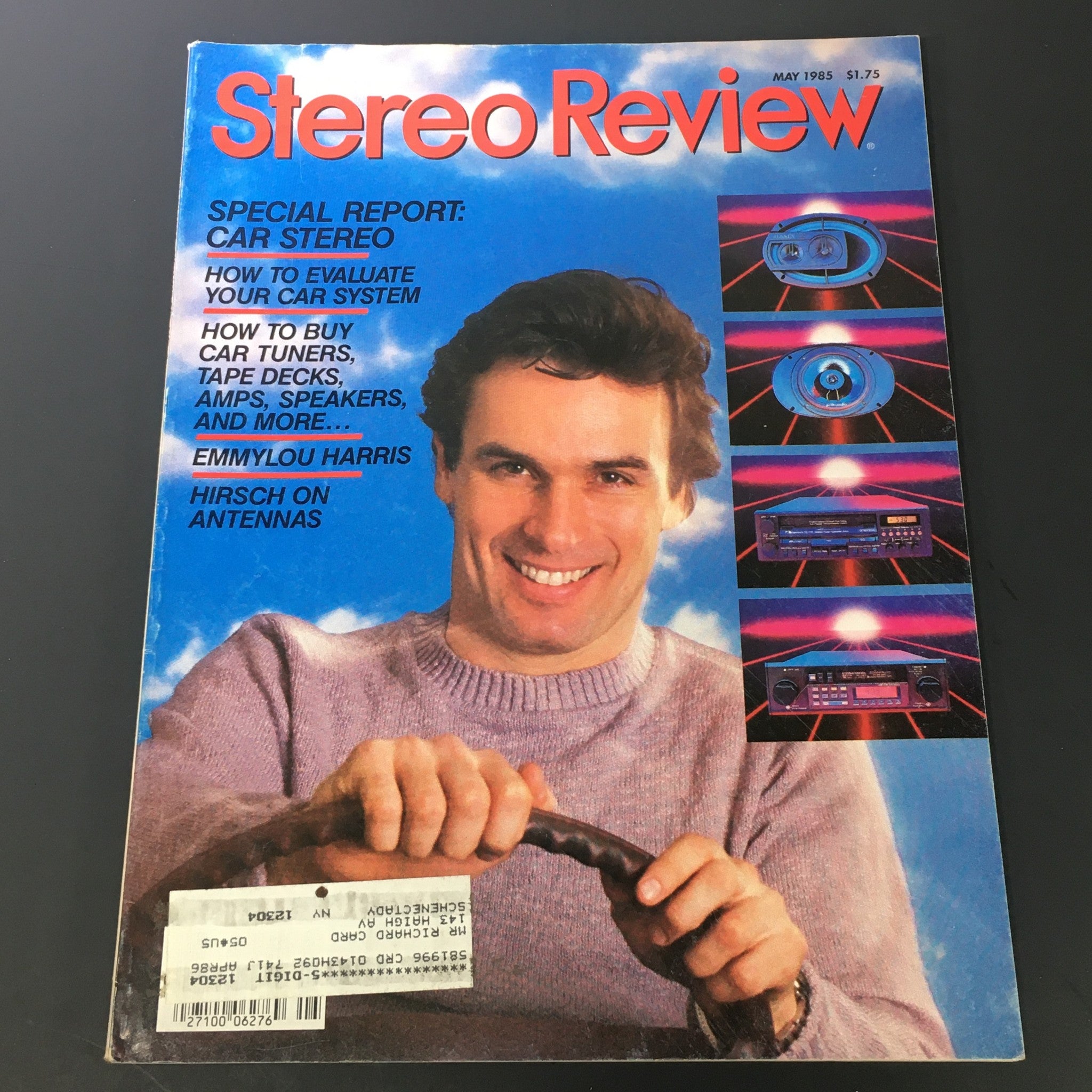 Vintage Stereo Review Music Magazine from May 1985 featuring Emmylou Harris. The cover showcases a smiling man holding a car steering wheel with articles on car stereo systems, including a special report and a piece by Hirsch on antennas.
