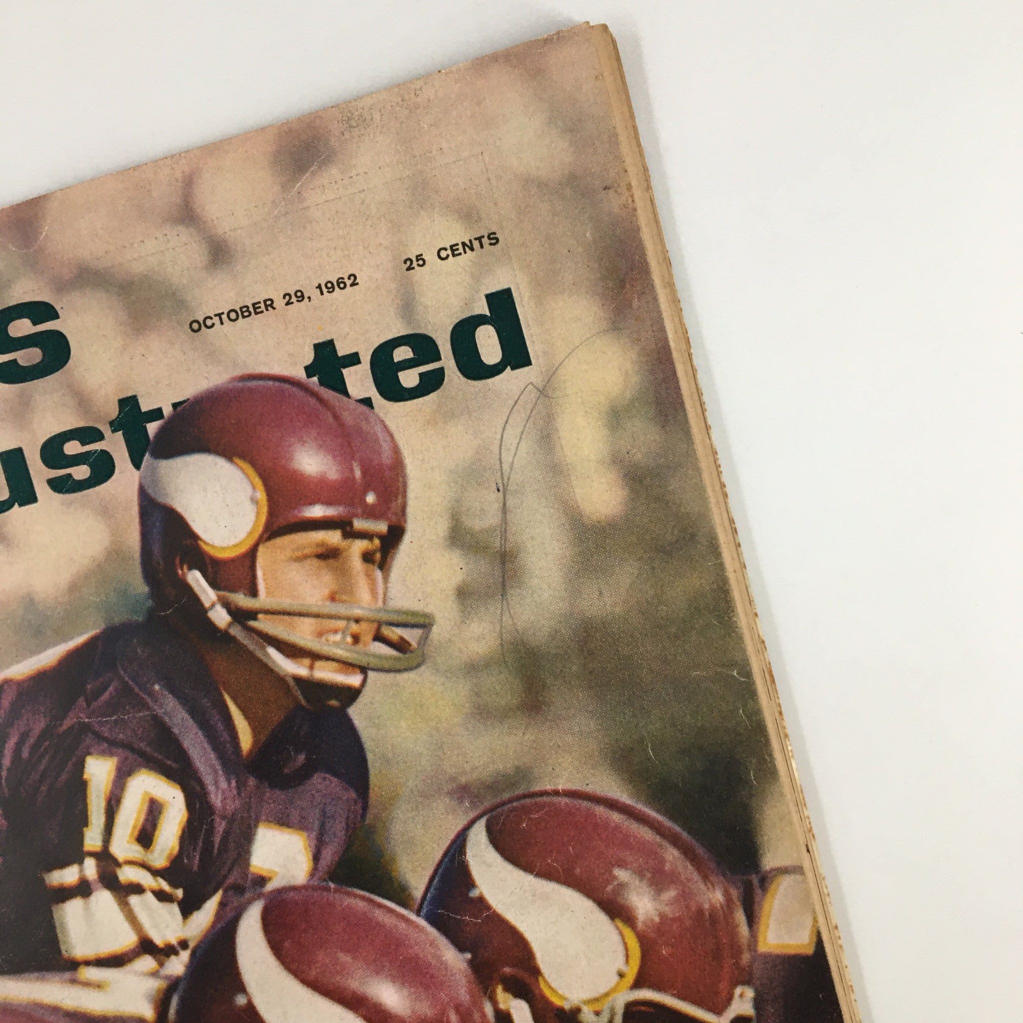 Close-up view of the October 29, 1962 Sports Illustrated magazine cover featuring quarterback Fran Tarkenton, highlighting his iconic status in football.