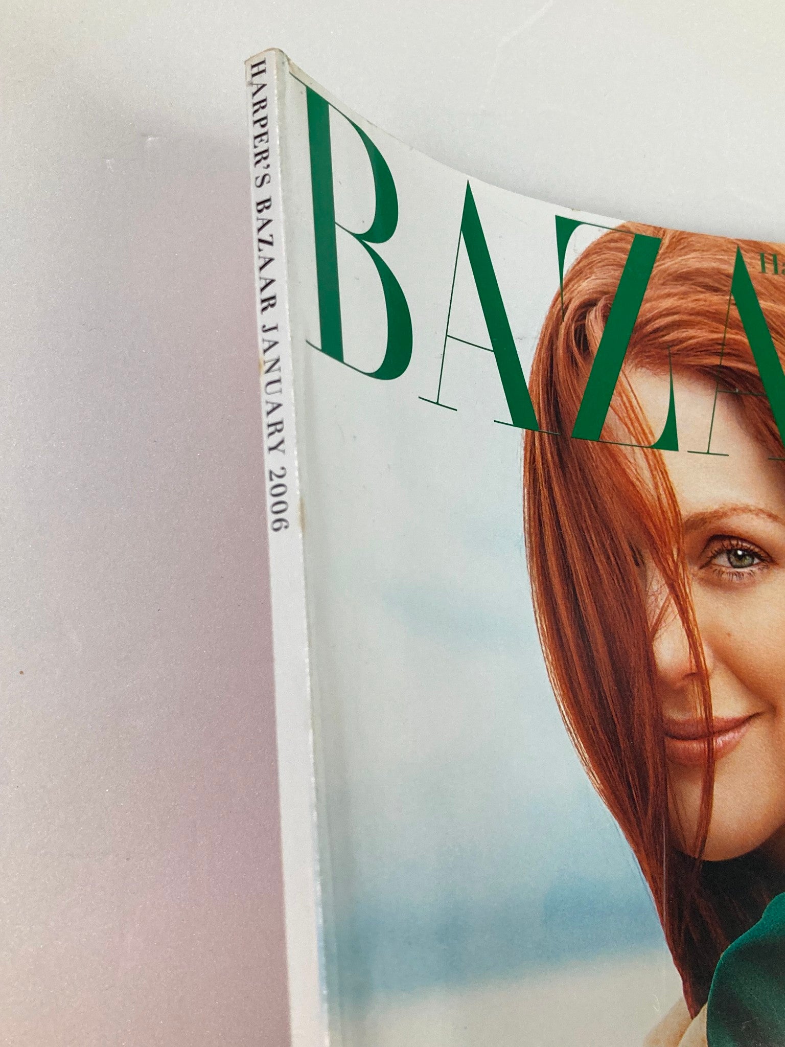 Close-up view of the spine of Harper's Bazaar Magazine January 2006, highlighting the date and magazine title with Julianne Moore on the cover.