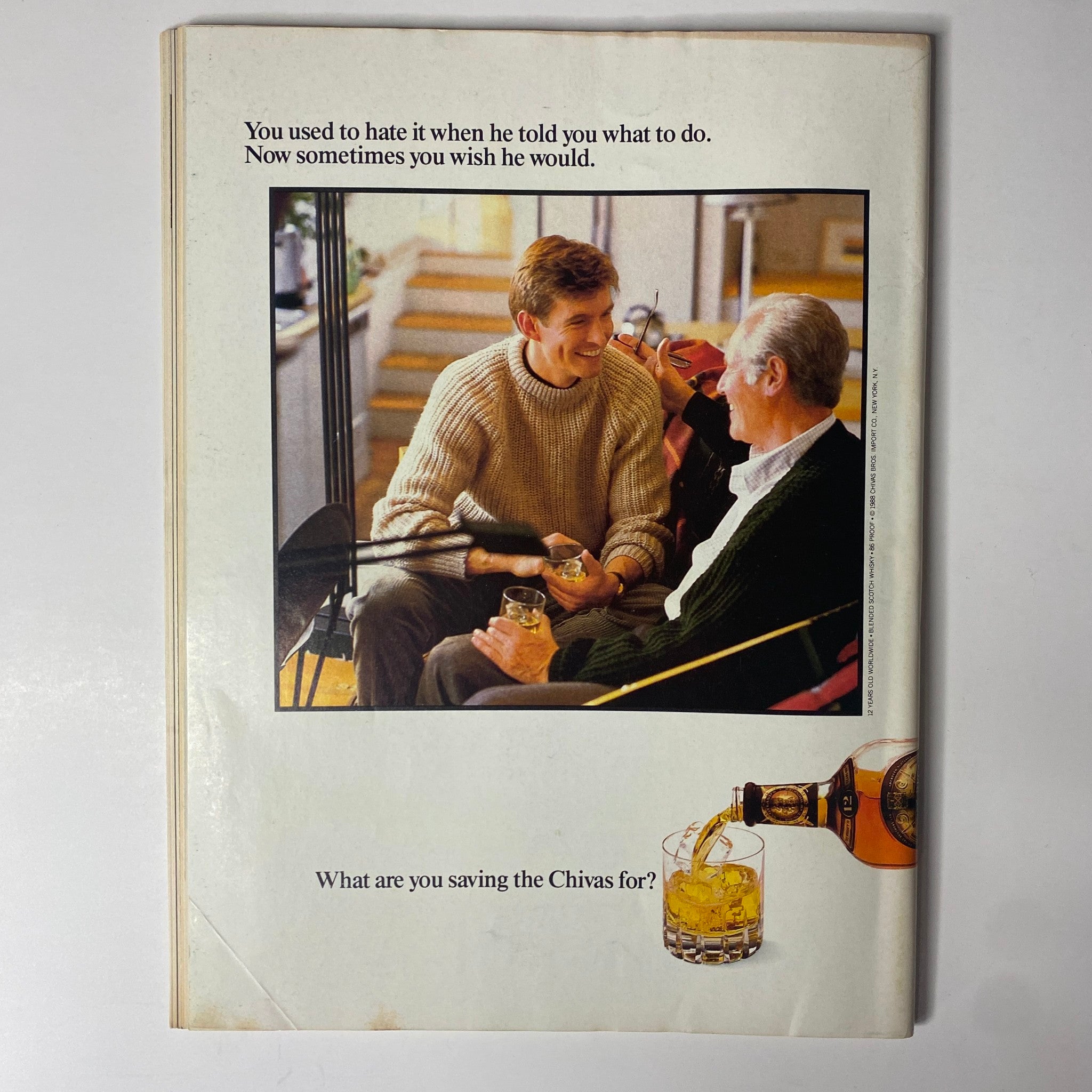 Back cover of Forbes Magazine May 2, 1988, illustrating an advertisement for Chivas whiskey, depicting a conversation between a father and son.