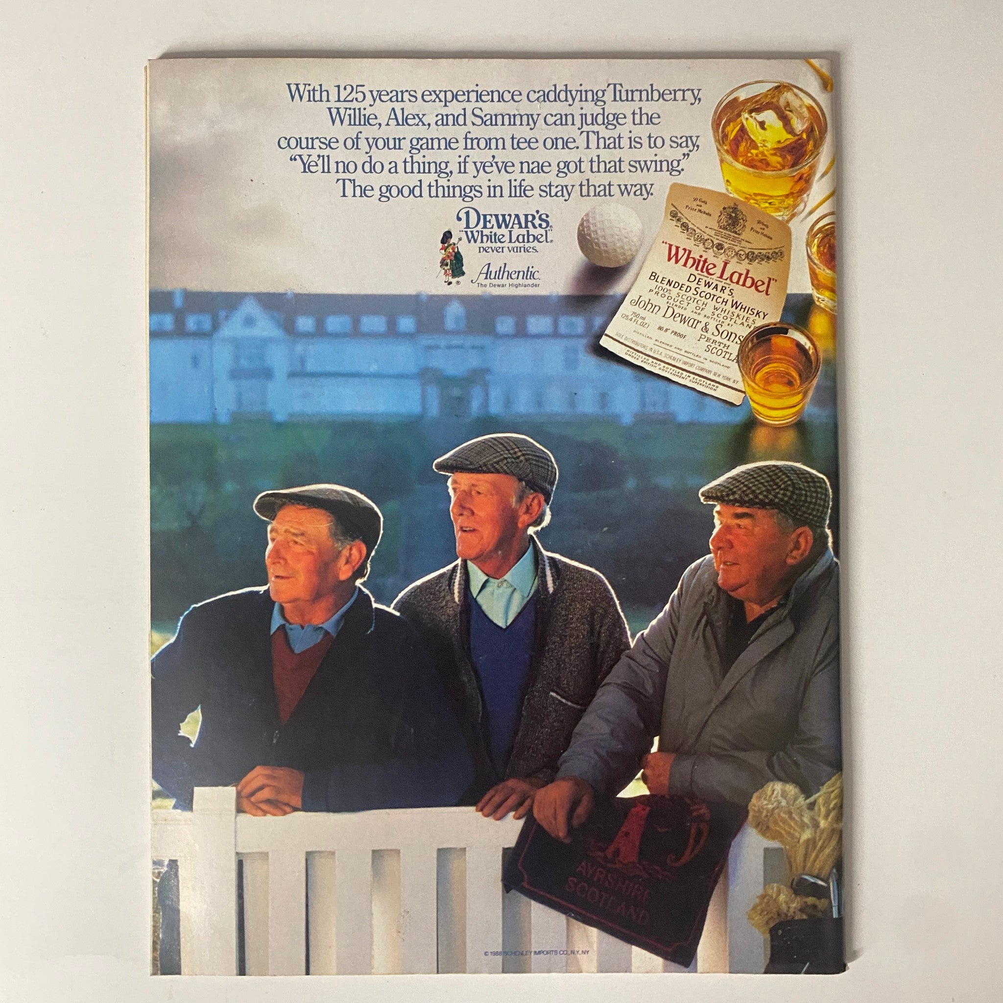 Back cover advertisement of Dewar's White Label whisky from Forbes Magazine June 13, 1988, showcasing three men in traditional Scottish attire, promoting the brand with a slogan about quality and experience in caddying.