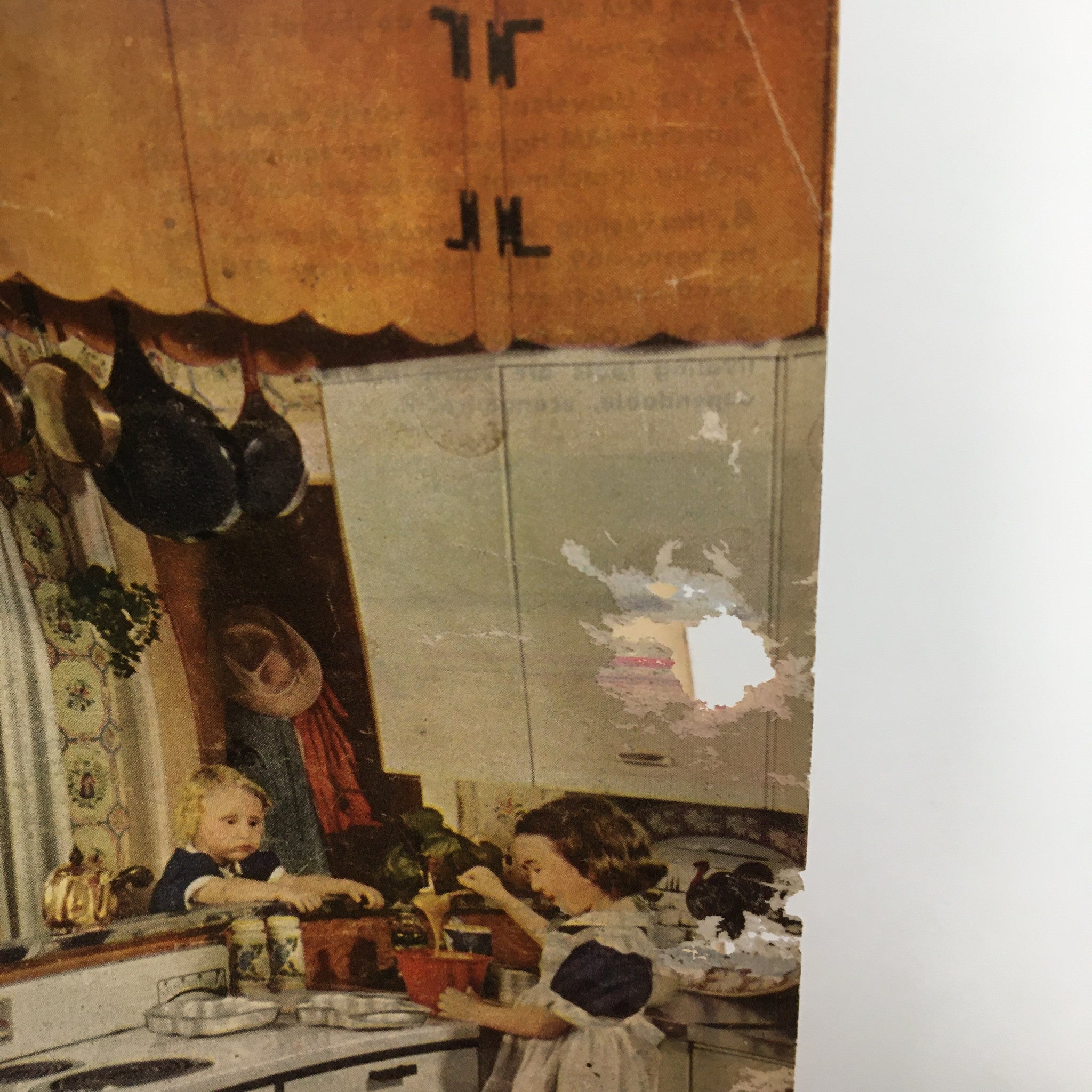 Close-up view of the top corner of the VTG Successful Farming Magazine November 1951, highlighting minor damages and revealing children engaged in cooking.