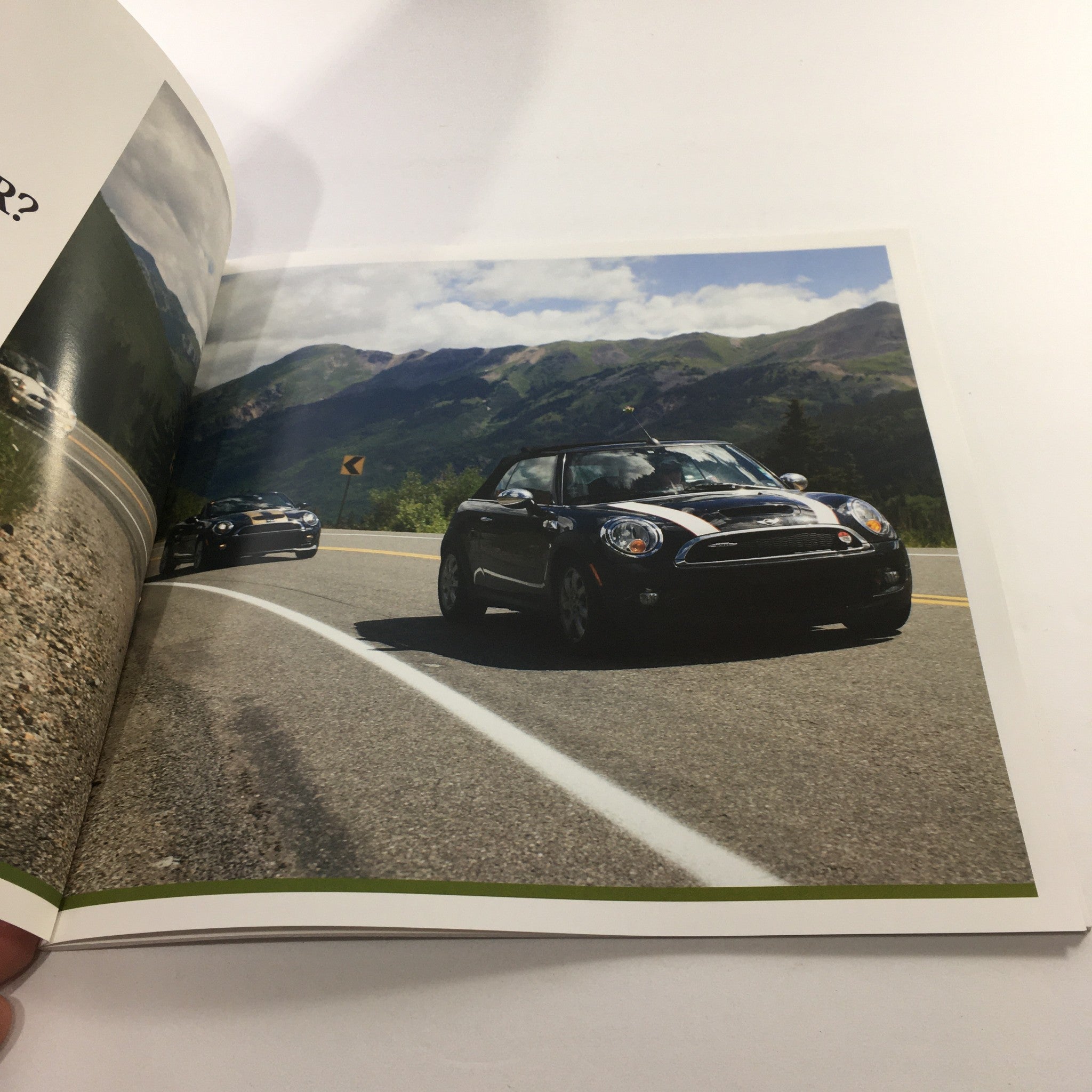 Interior page of the 2016 Mini Cooper Motor The Spectrum Colors Dealership Car Auto Brochure Catalog showing Mini cars driving on a scenic highway with mountains in the background.