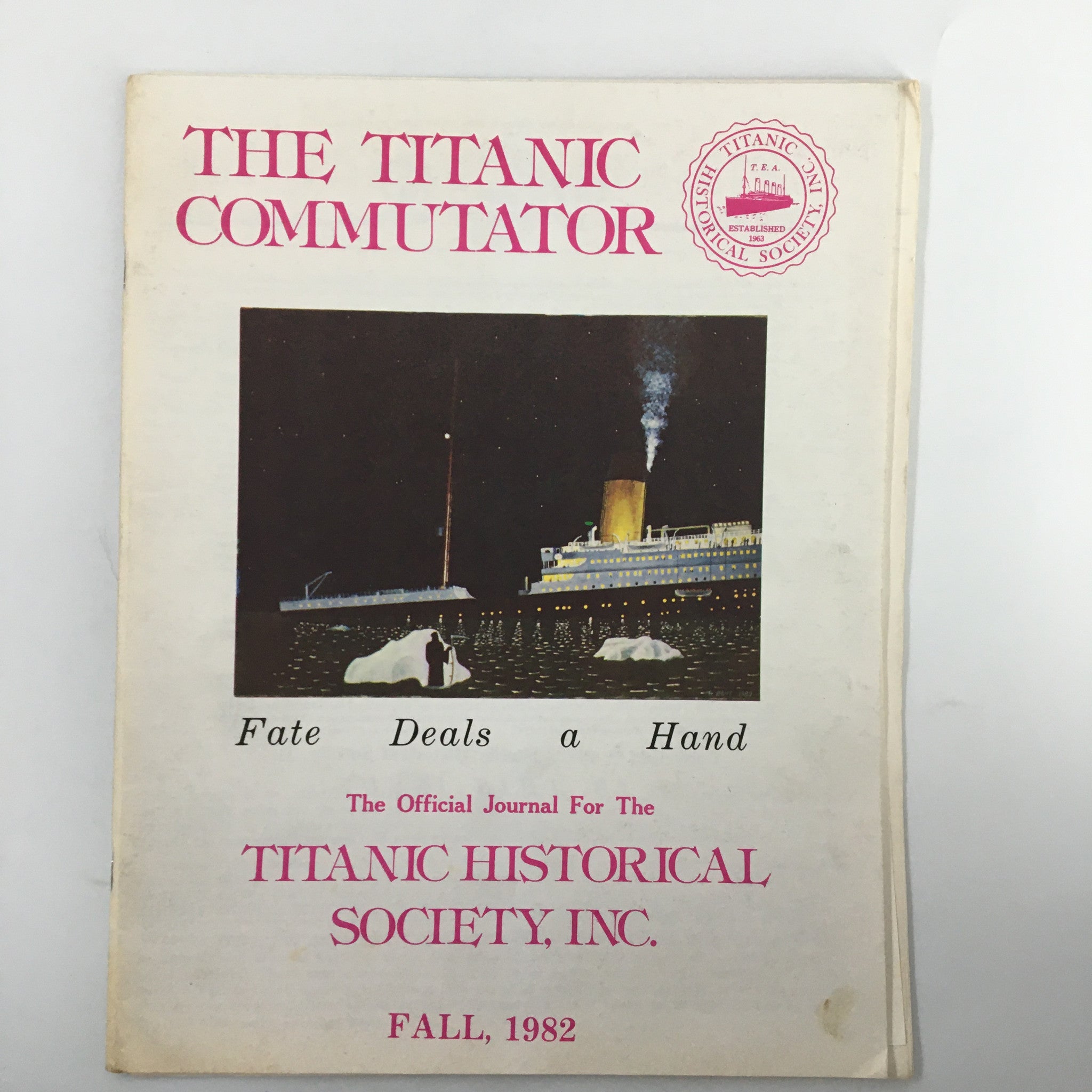 Cover of the magazine 'The Titanic Commutator' Fall 1982 edition titled 'Fate Deals a Hand' featuring the Titanic and icebergs.