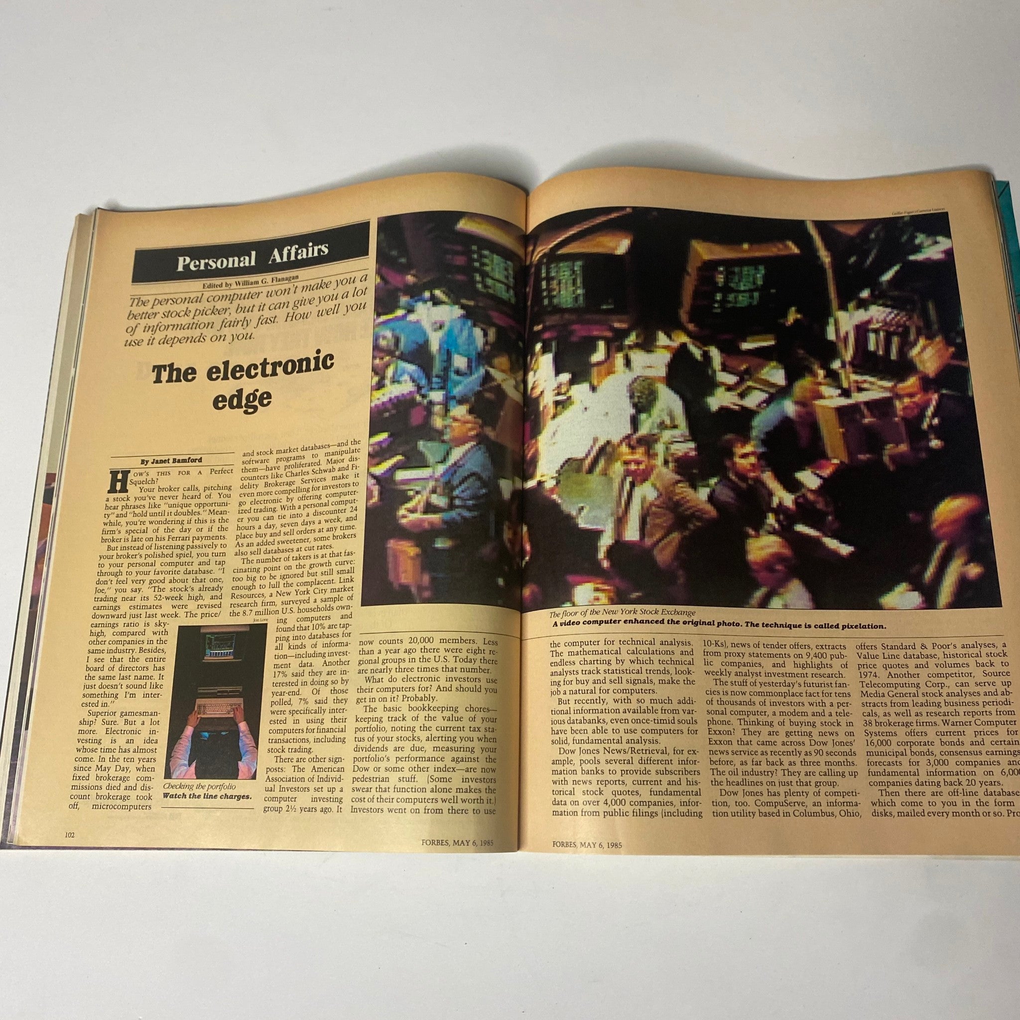 A featured article from Forbes Magazine dated May 6, 1985, titled 'The electronic edge,' discussing the impact of personal computers on the stock market and investment strategies, with an image illustrating the trading floor at the New York Stock Exchange.