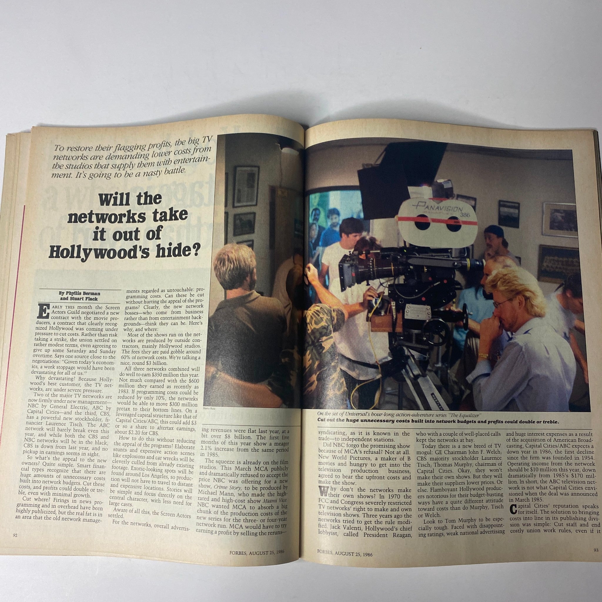 Spread from Forbes Magazine August 25, 1986, showcasing the cover story 'Will the Networks Take It Out of Hollywood's Hide?' with a scene from a film set.