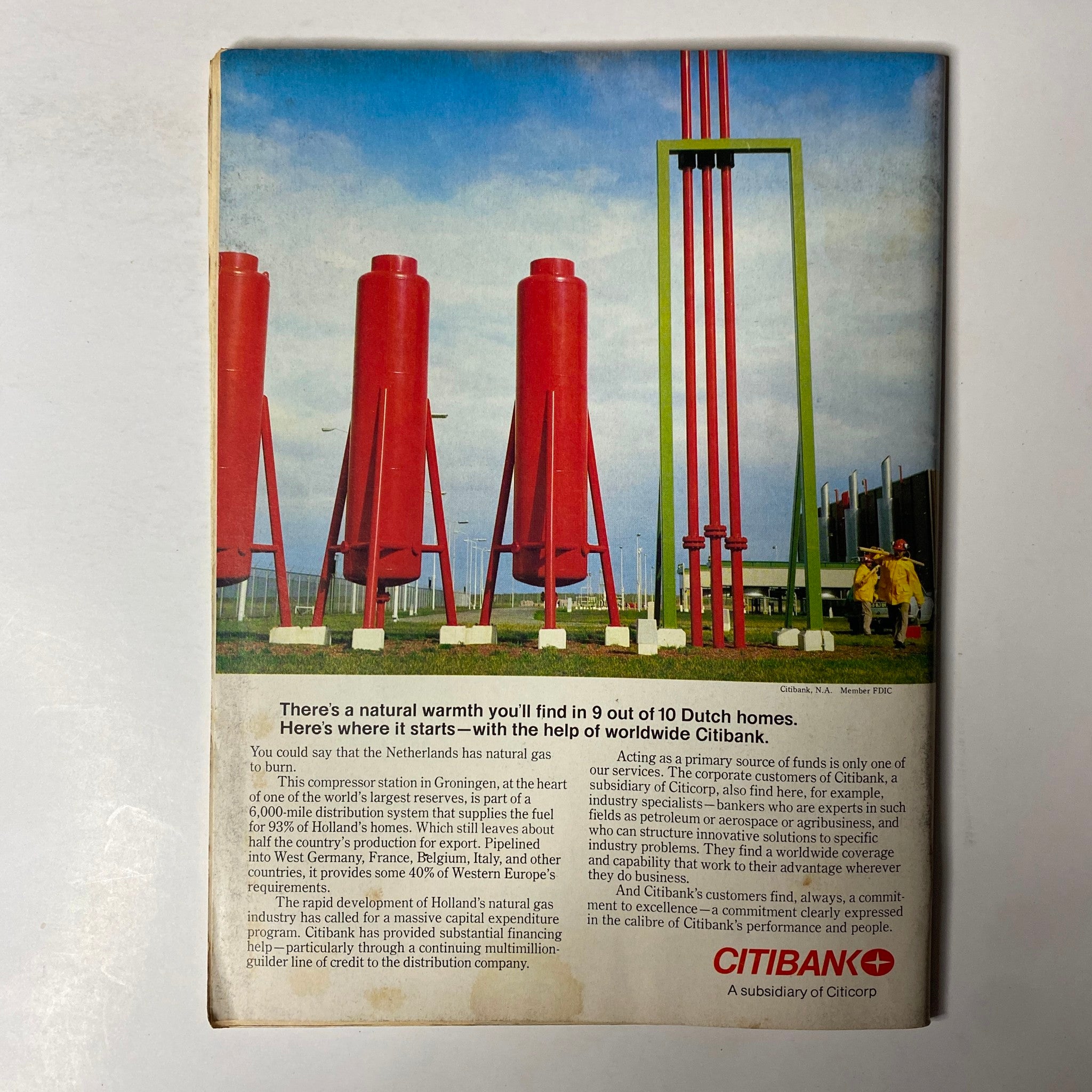 Forbes Magazine October 1, 1977 cover featuring an industrial scene with red compressor stations and green piping, illustrating the energy industry discussion in the issue 'The Doctors' Time of Troubles'.