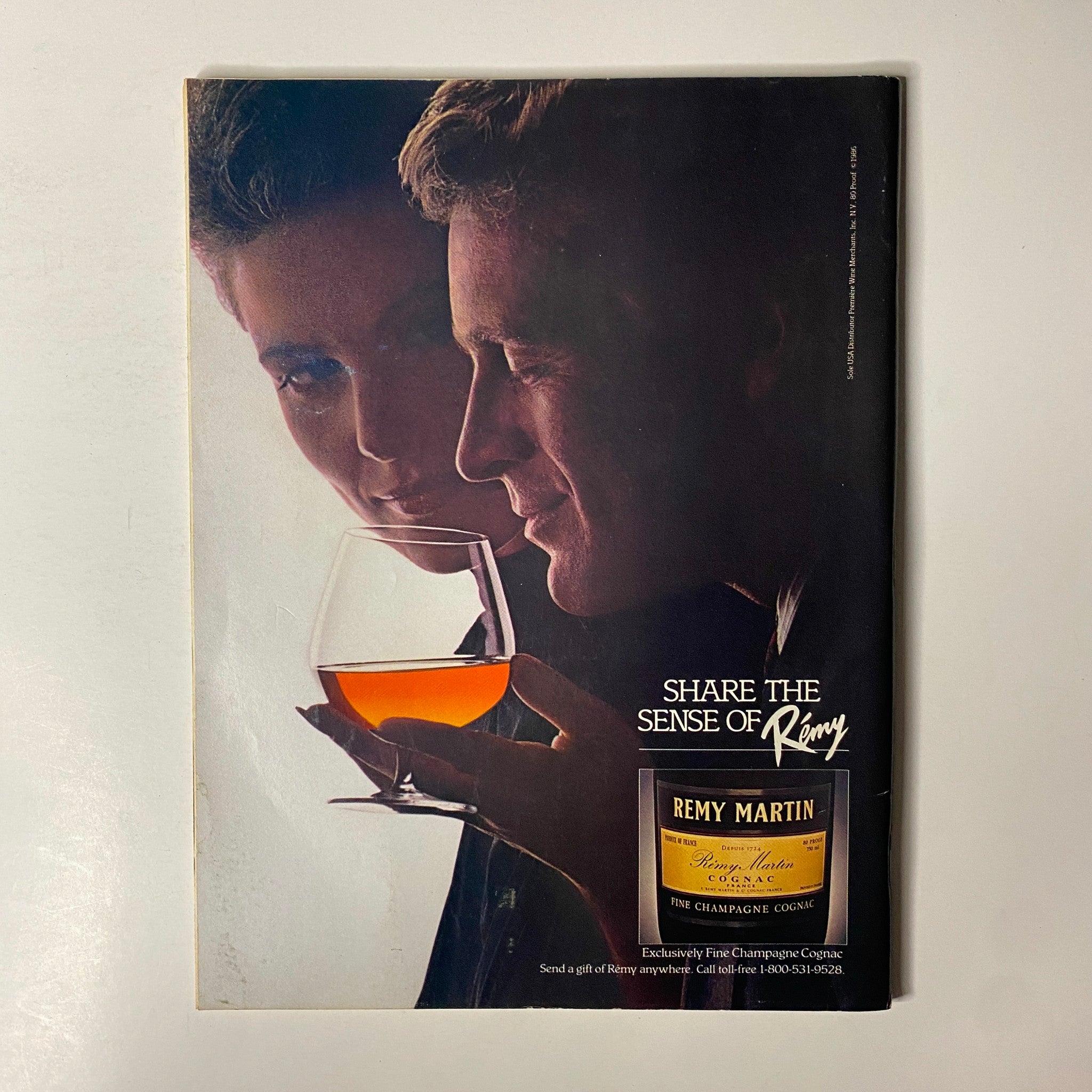 Advertisement from Forbes Magazine December 29, 1986 for Remy Martin showcasing a sophisticated couple with fine cognac.