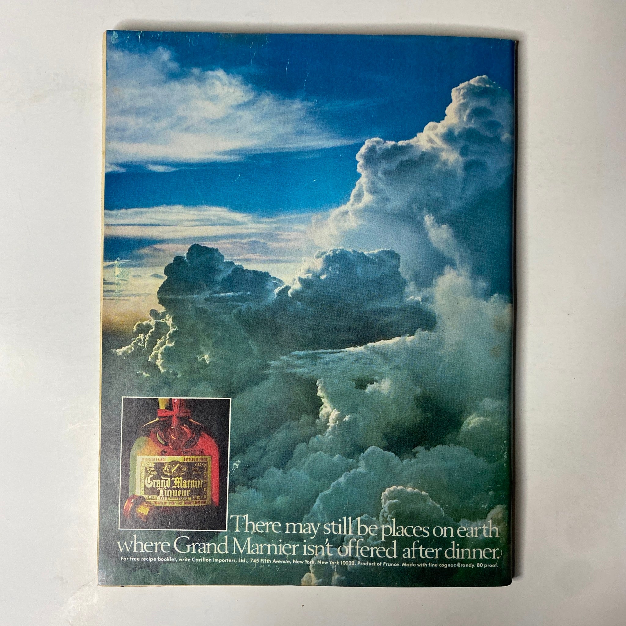 Back cover of Forbes Magazine October 16, 1986 featuring an advertisement for Grand Marnier with a scenic cloud background.