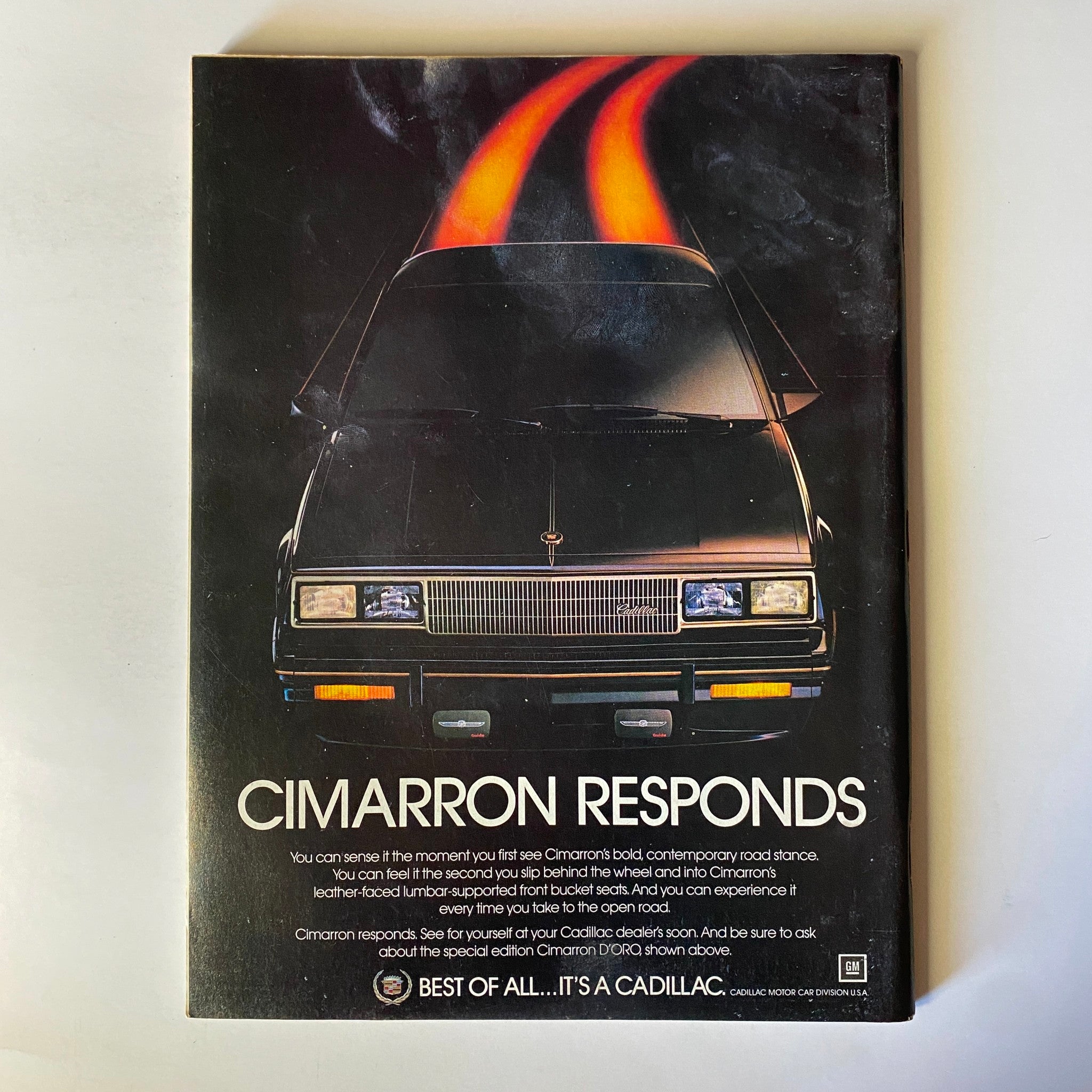 Forbes Magazine April 25, 1983 Ford Motor's Make-or-Break Year, featuring an advertisement for the Cadillac Cimarron highlighting its bold design.