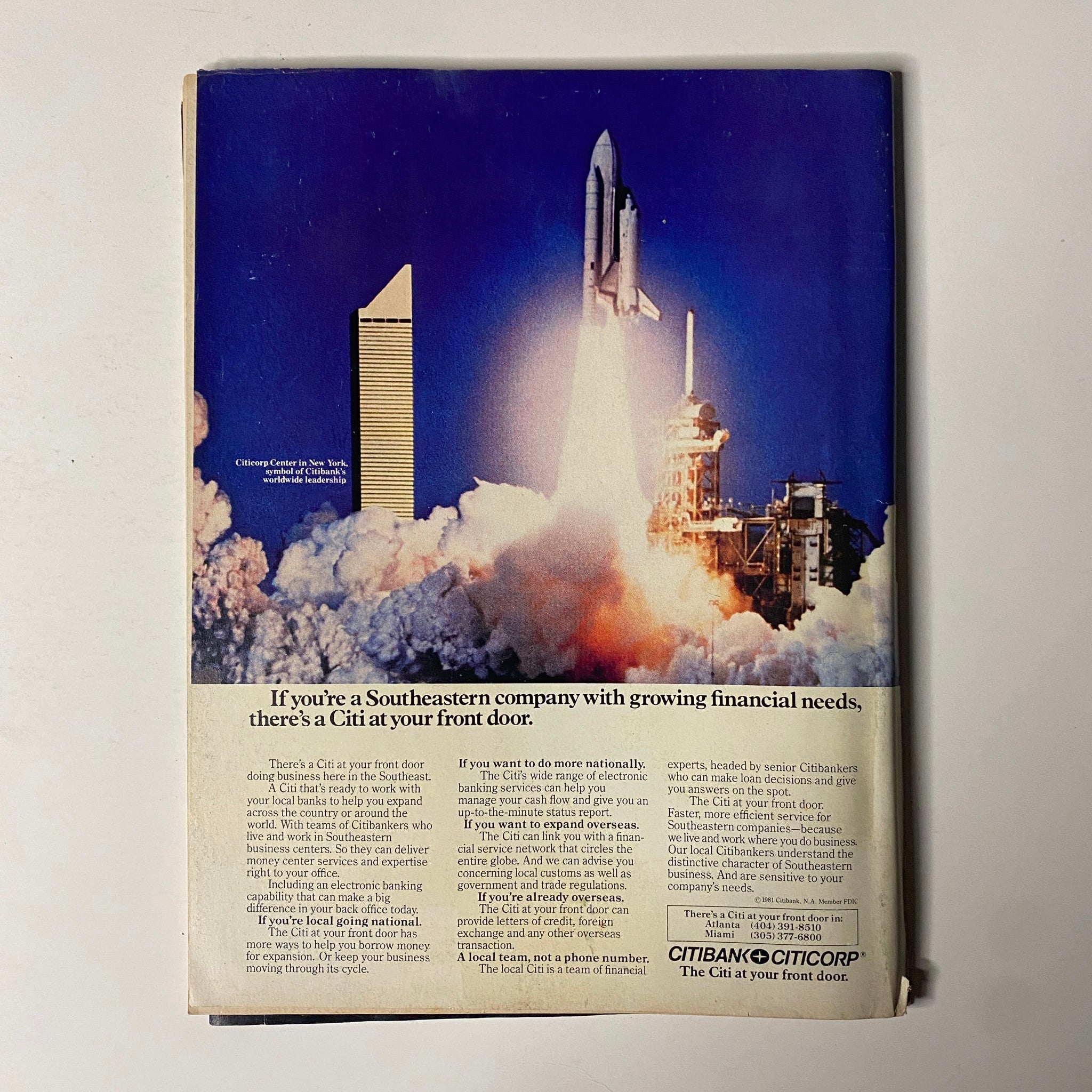 Advertisement from Forbes Magazine February 1, 1982 featuring a space shuttle launch and promoting Citibank's services for Southeastern companies. This vintage image highlights financial solutions amidst economic insights.