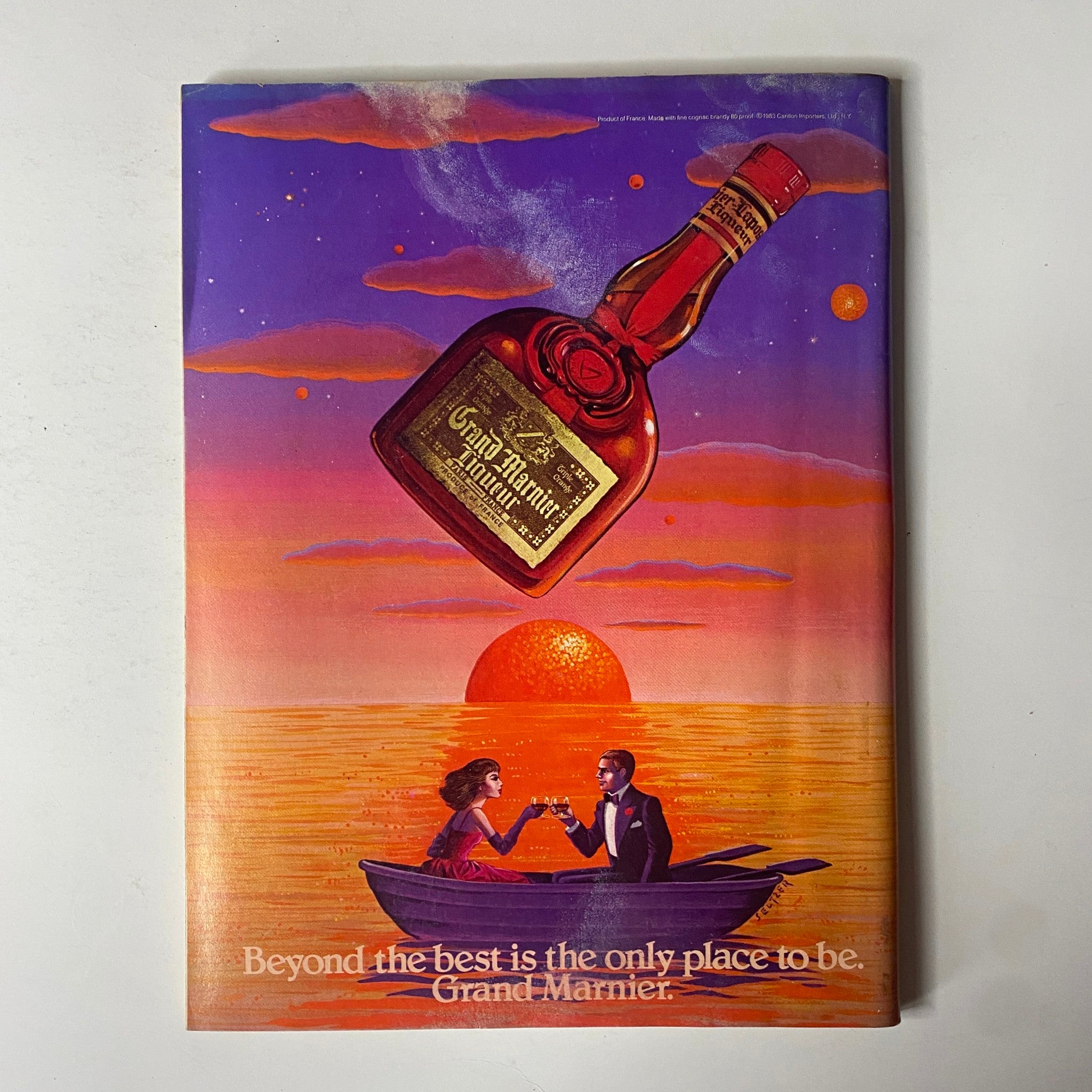 Forbes Magazine - September 12, 1983, Advertisement for Grand Marnier Featuring Romantic Scene Against a Sunset Background.