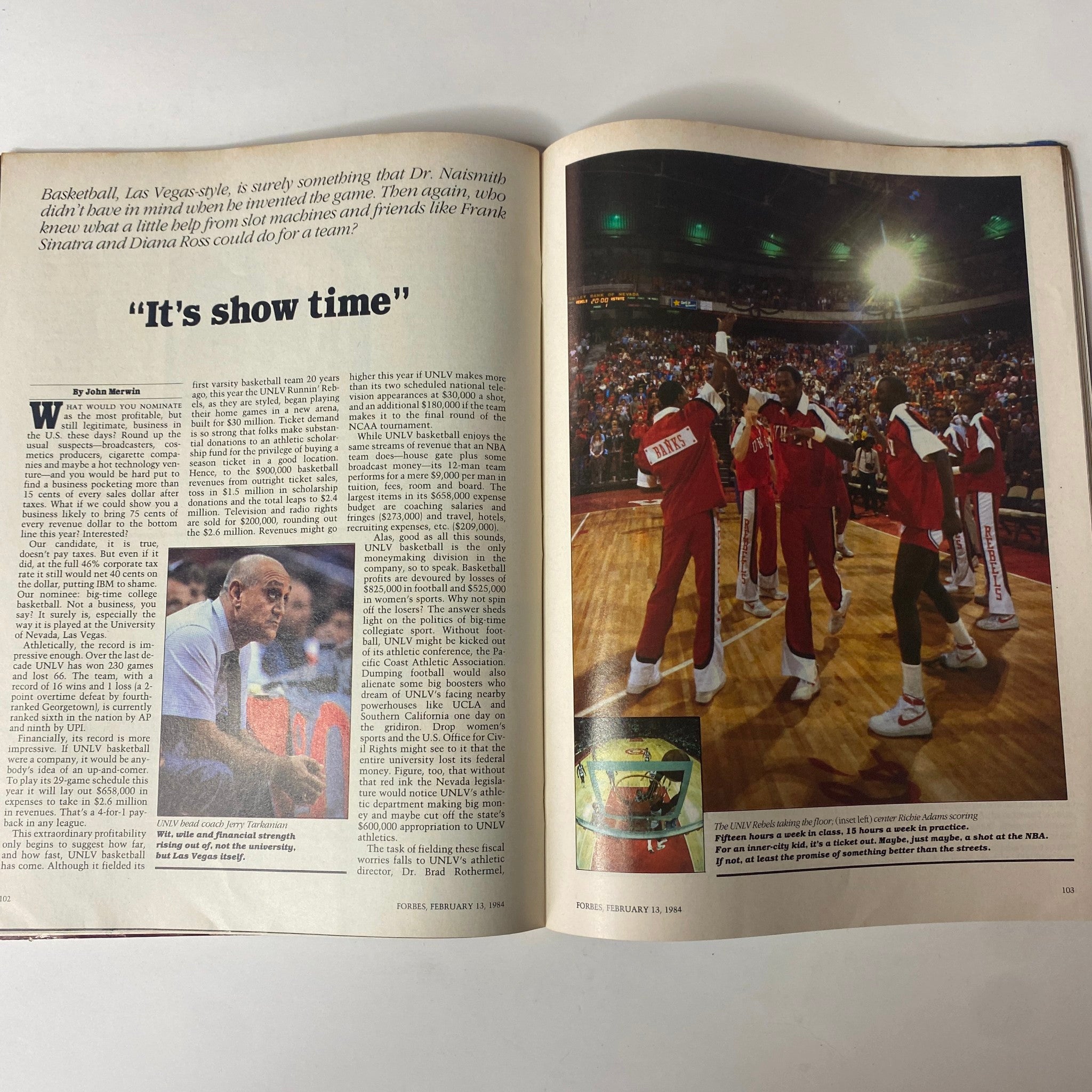 Forbes Magazine February 13, 1984, showcasing an article titled 'It's show time,' which discusses college basketball, particularly at UNLV, and the intersection of sports and business.