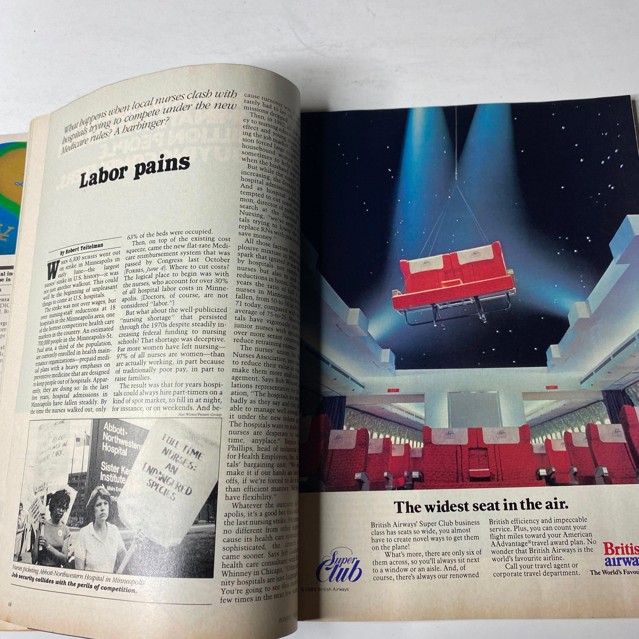 Engaging article spread from Forbes Magazine July 2, 1984 discussing labor issues in healthcare and featuring an image of British Airways' seating.