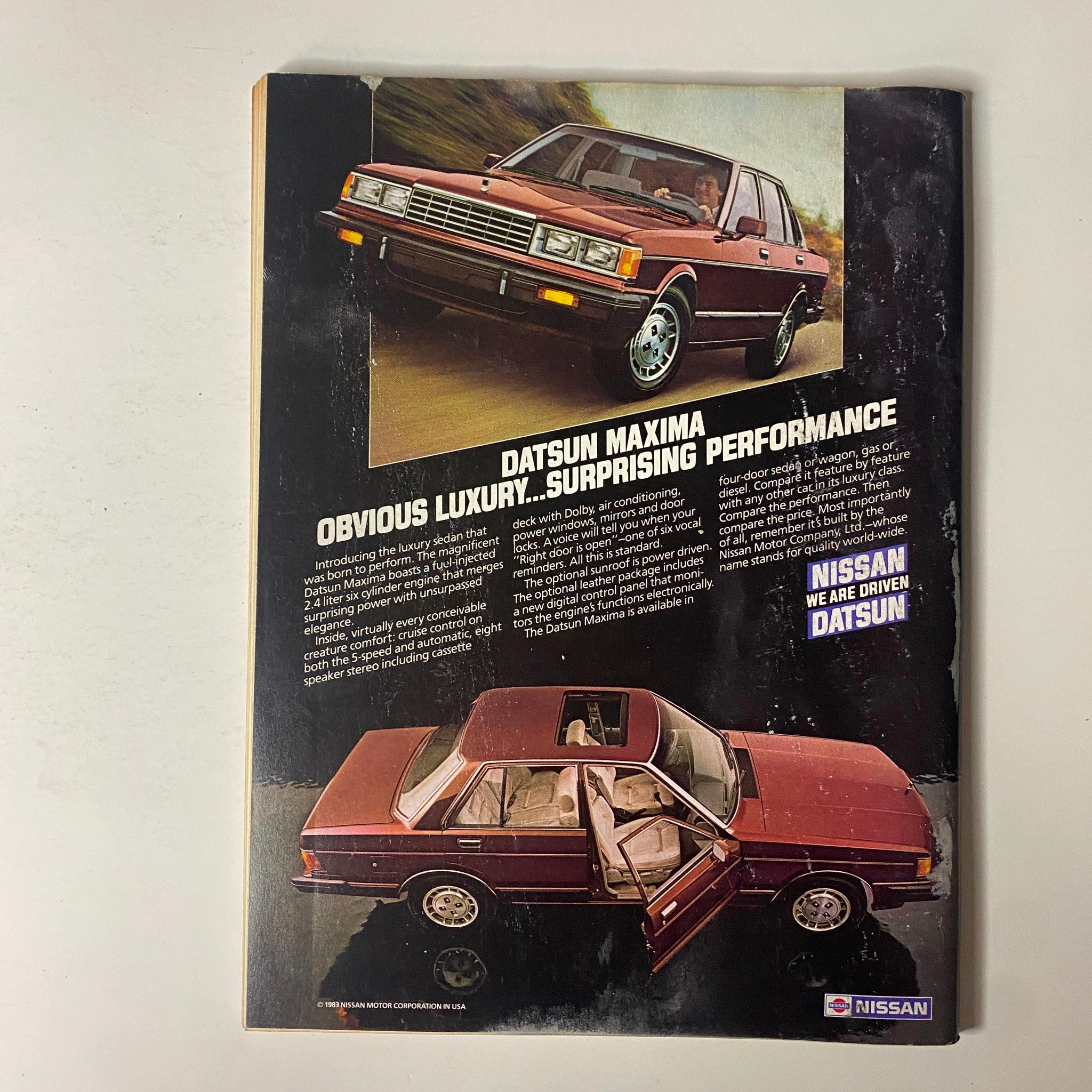 Advertisement for the Datsun Maxima featured in Forbes Magazine August 29, 1983, highlighting its luxury and performance.