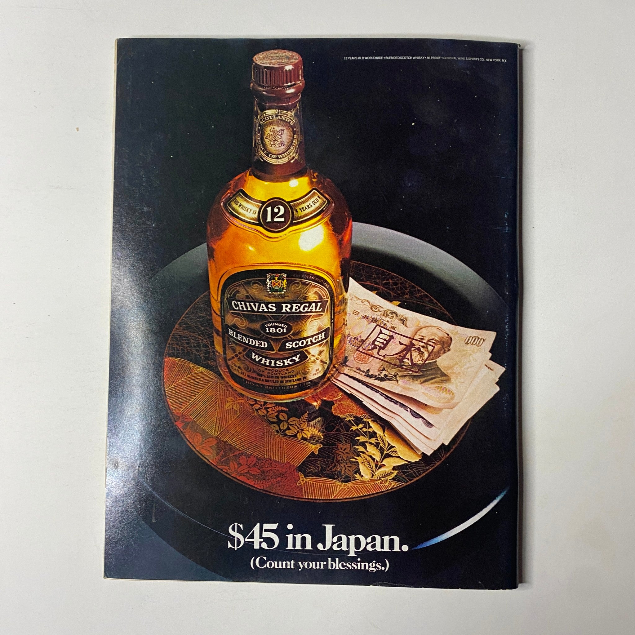 Forbes Magazine September 26, 1983, featuring an advertisement for Chivas Regal Scotch whisky placed alongside Japanese currency, with the text '$45 in Japan. Count your blessings'.