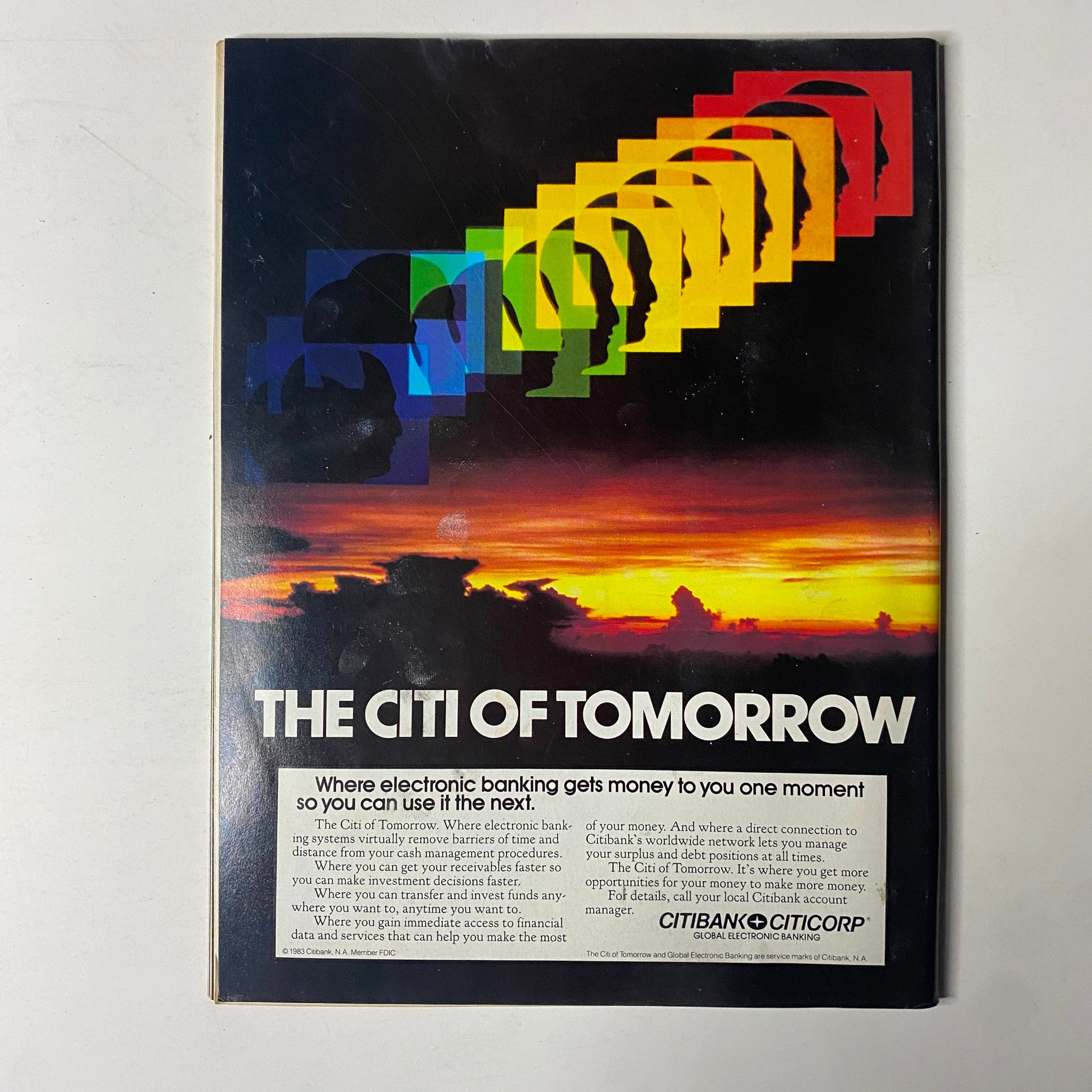 Advertisement page in Forbes Magazine January 31, 1983 for Citibank, highlighting the future of electronic banking with colorful visual elements and a sunset background.